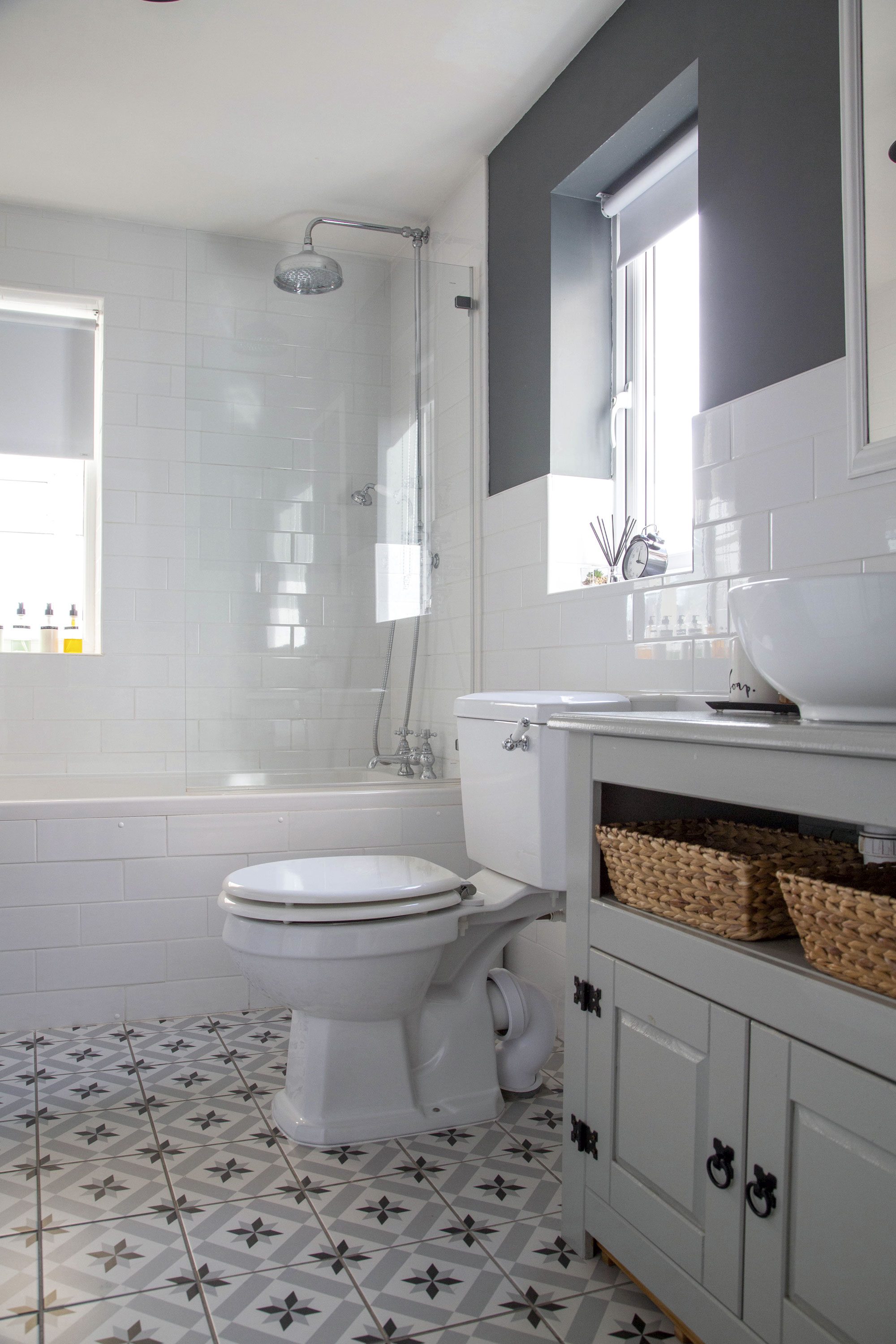 Previously, the bathroom had a green-brown suite, mould and a hole in the outside wall. The couple reconfigured the layout to allow more floorspace and redecorated with a white and grey palette for a fun, classic-meets-modern feel Previously, the bathroom had a green-brown suite, mould and a hole in the outside wall. The couple reconfigured the layout to allow more floorspace and redecorated with a white and grey palette for a fun, classic-meets-modern feel