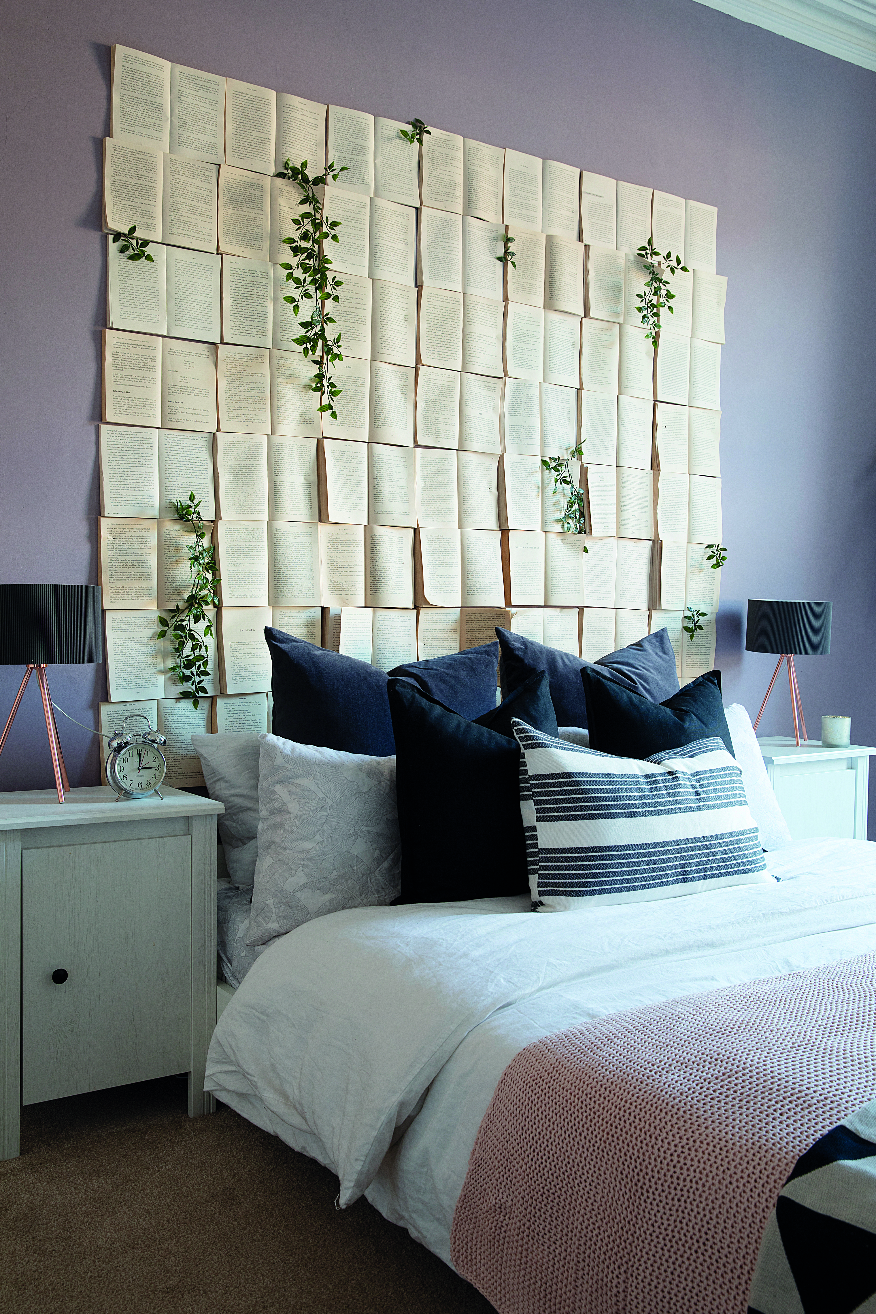 I made it from old books we already had and nailed them to the wall,’ says Charlotte. She bought the bedside table from IKEA A headboard made out of books