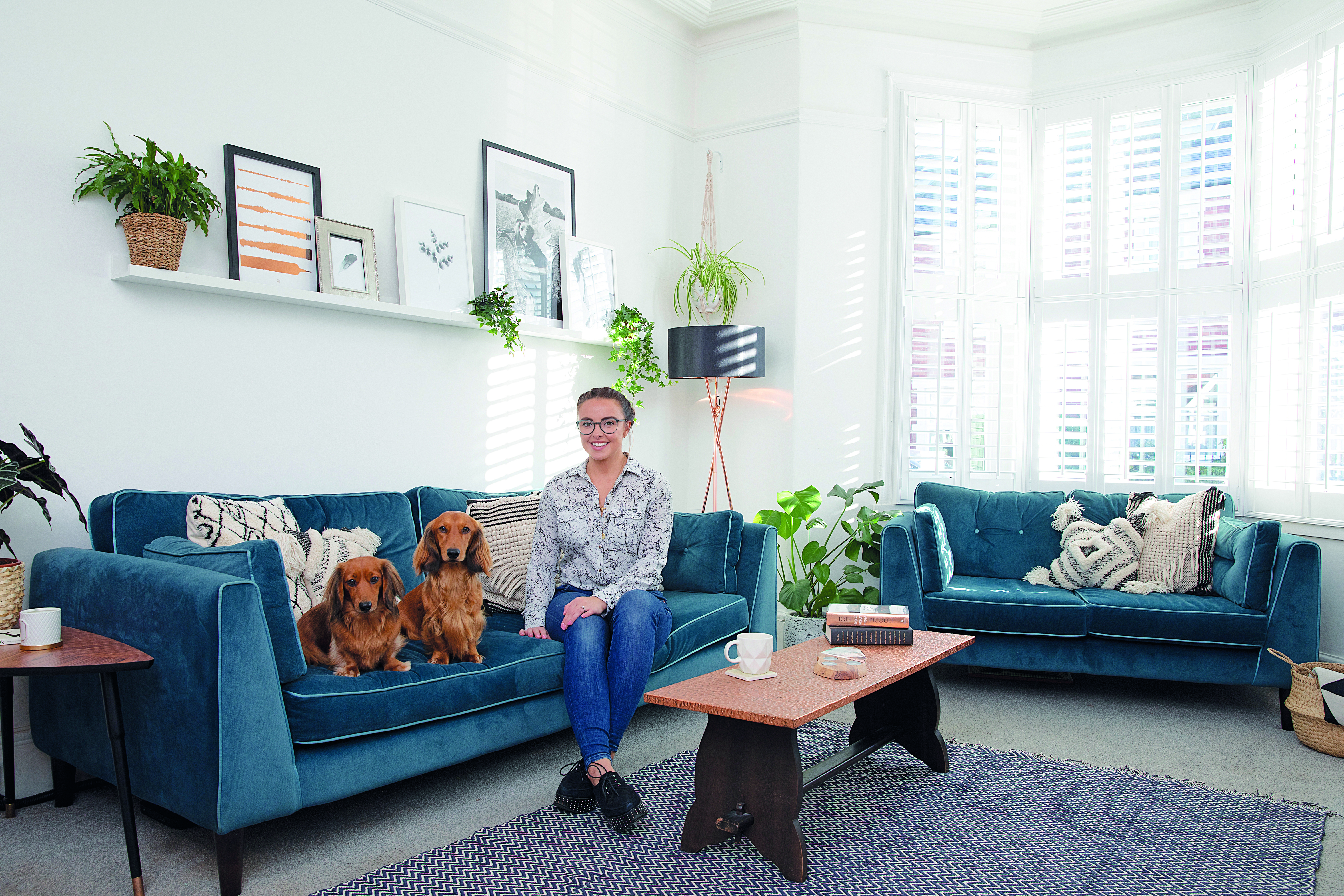Style idea! Sticking to monochrome cushions with a colourful statement sofa is a fail-safe option A blue statement sofa