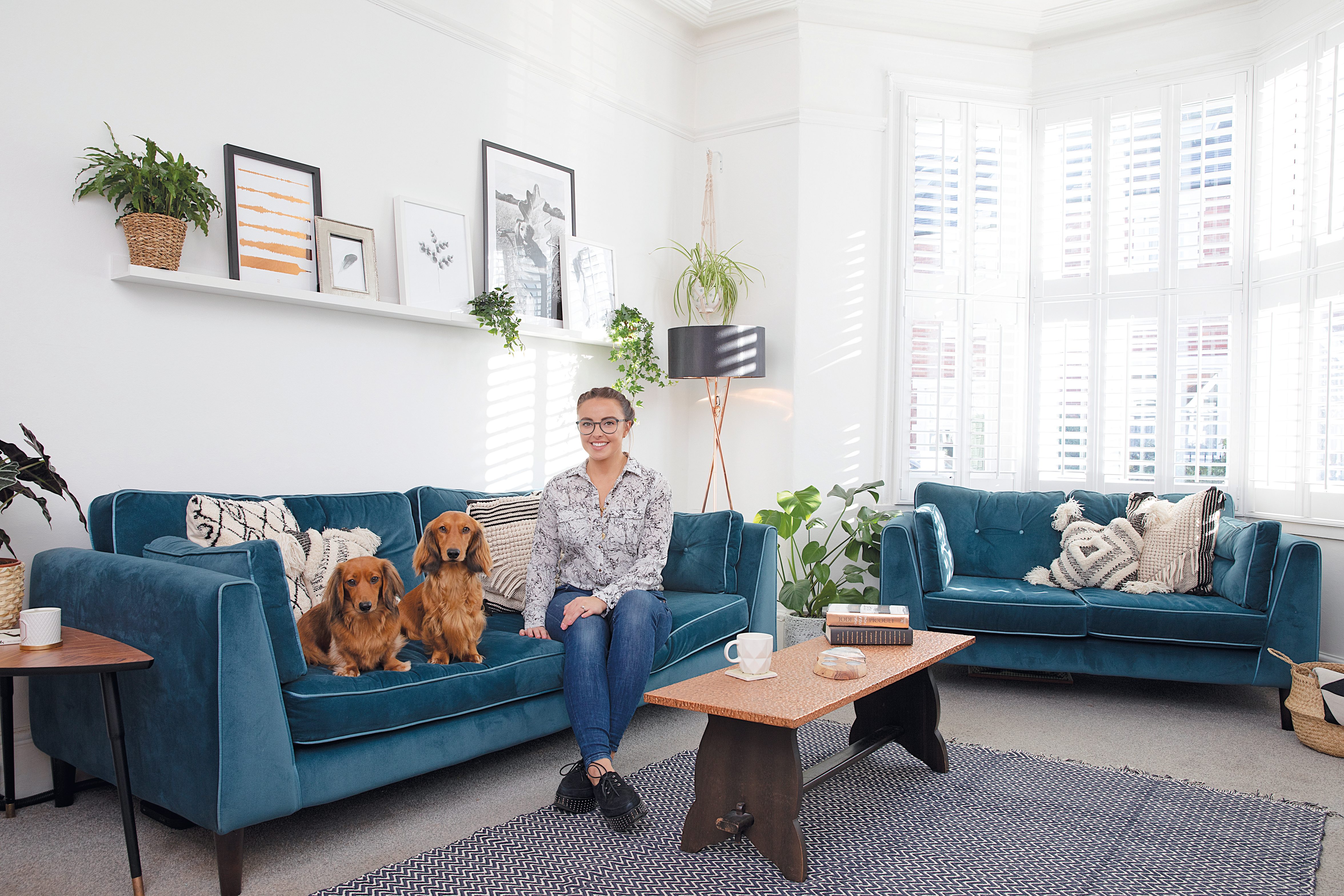 Style idea! Sticking to monochrome cushions with a colourful statement sofa is a fail-safe option A blue statement sofa