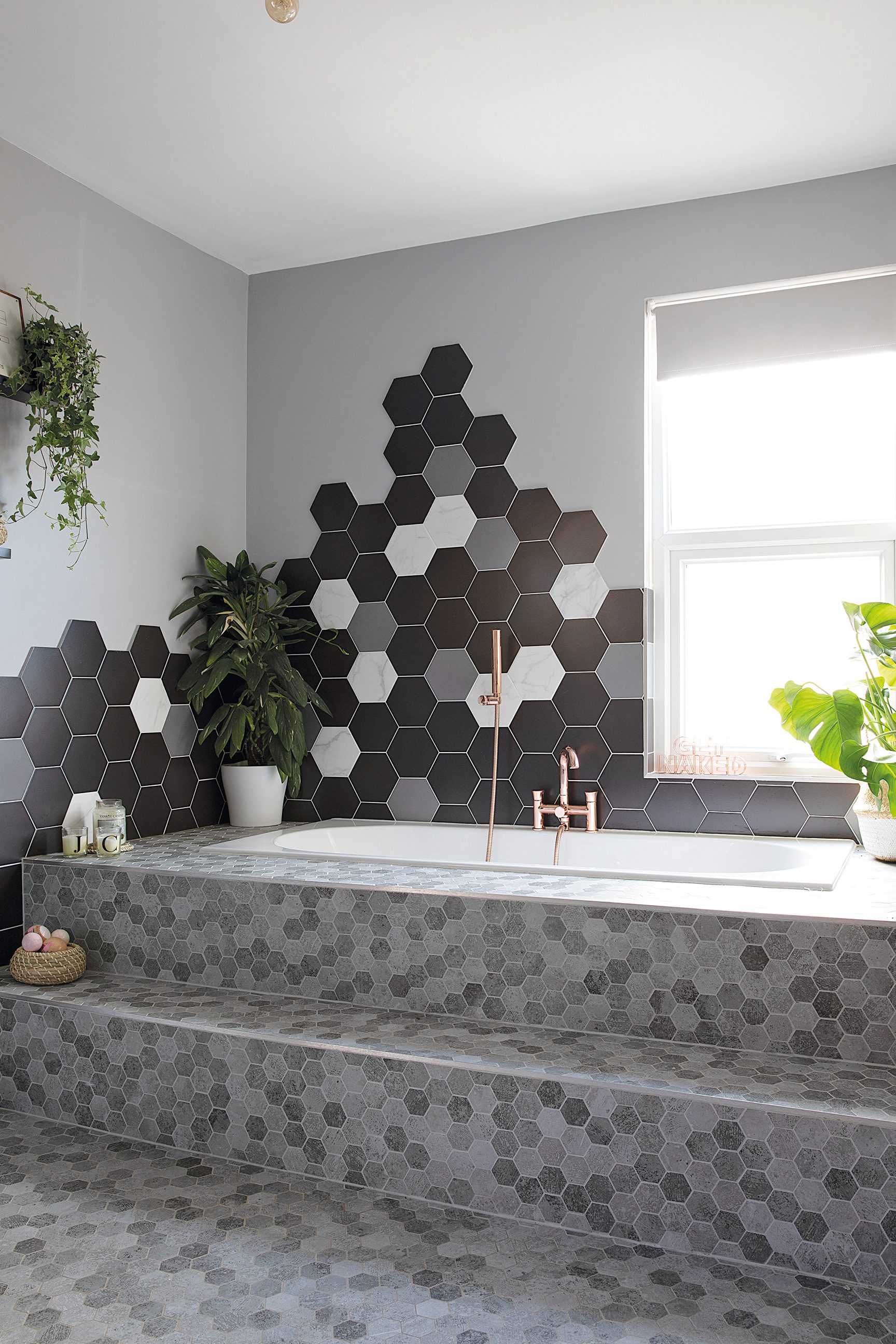 Although the hexagon tiles were tricky to fit, Charlotte loves the luxurious look they bring to her new bathroom. British Ceramic Tile has similar hexagon wall tiles and Tiles Direct has similar mosaic floor tiles A boutique style bathroom with hexagon wall tiles