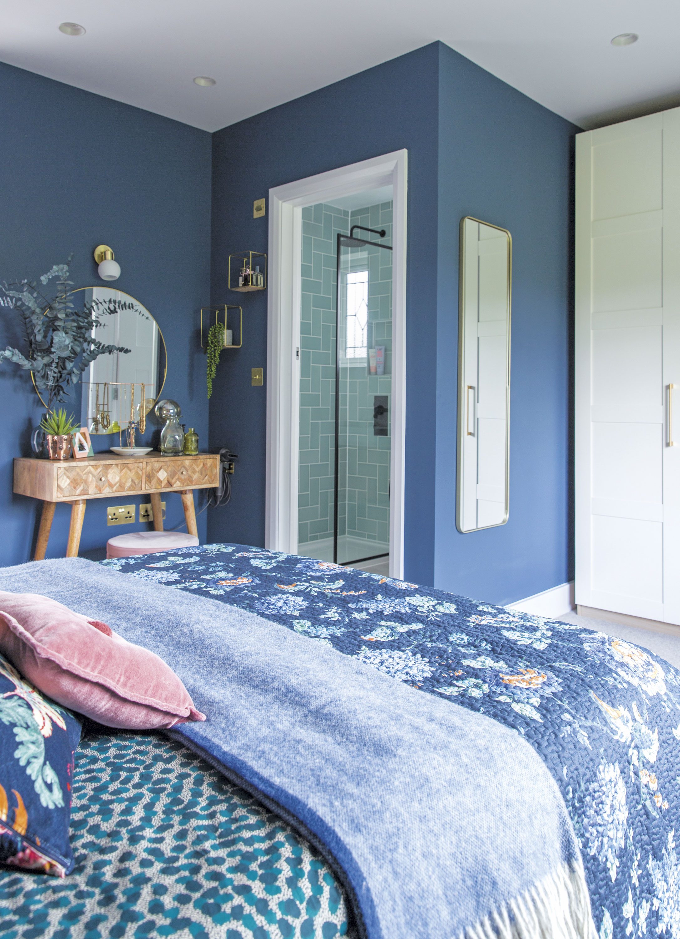 Plenty of wardrobe space means Becky’s room is always kept neat and tidy. The white Shaker-style doors are finished off with brass handles, which tie in with the other metallic details around the room Plenty of wardrobe space means Becky’s room is always kept neat and tidy. The white Shaker-style doors are finished off with brass handles, which tie in with the other metallic details around the room