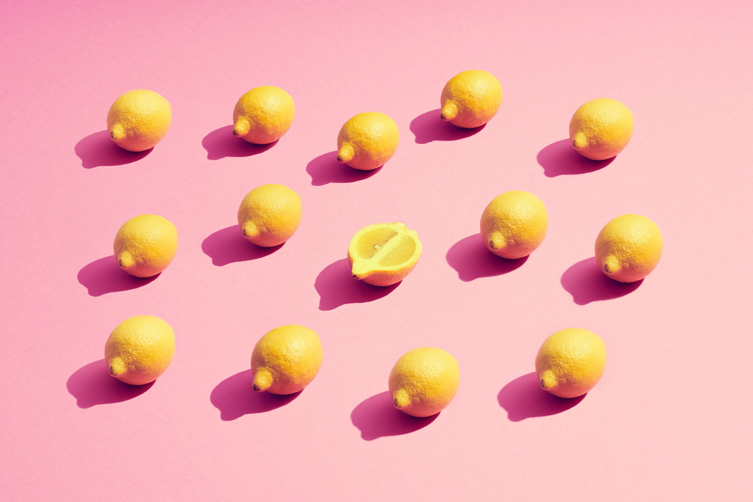 Fruit juice stain removal Lemons on a pink background