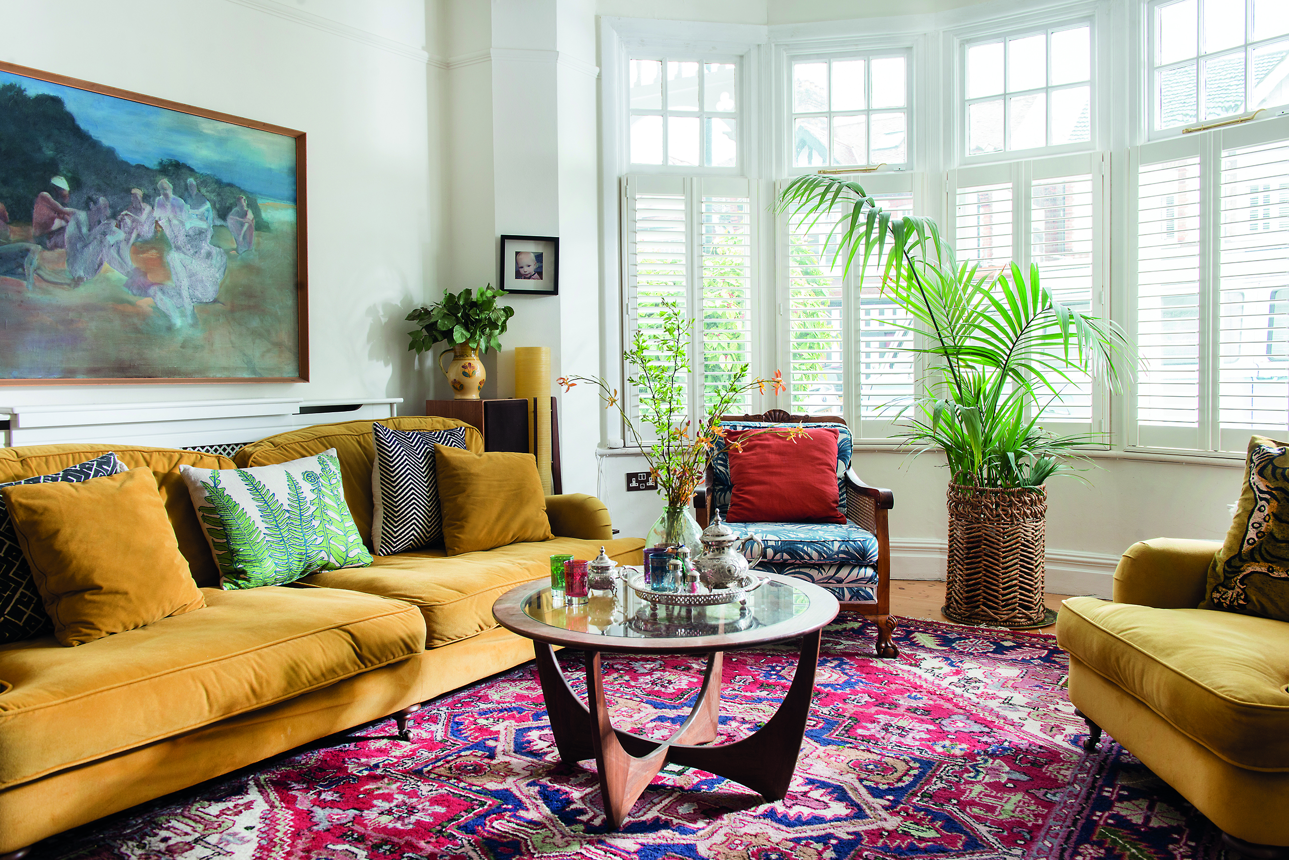 ‘I love having personal, meaningful things around me,’ says Sophie. ‘Our retro, glass-topped coffee table used to belong to my granny and I found the big painting, covered in dust, in my late dad’s attic some years ago’