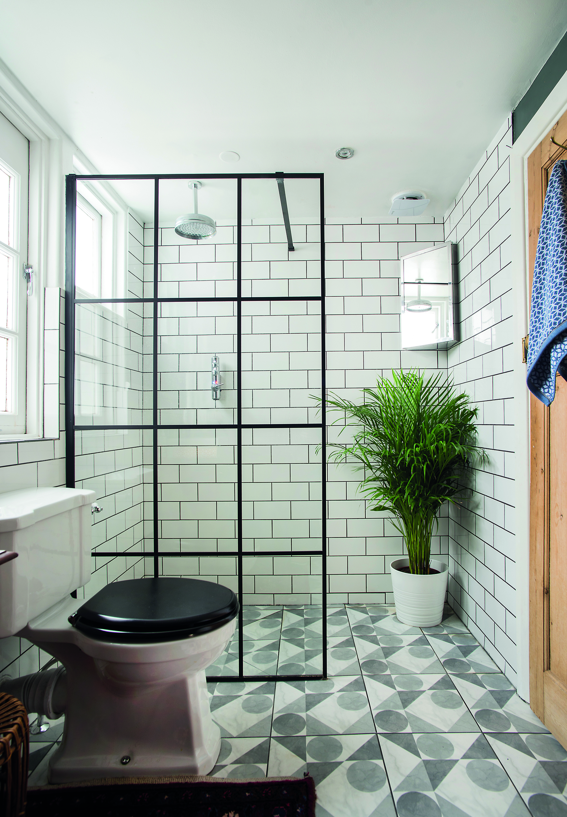 ‘I knew I wanted white metro wall tiles, with dark grey grout for impact. The black Crittall-look shower screen was another must-have as it picks up the rectangular pattern. I rescued the nifty corner cabinet from the recycling centre’