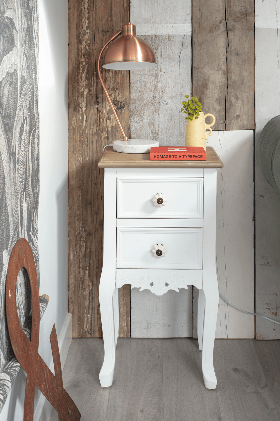 An old wooden bedside table from Dunelm has been painted off-white by Annie and is used as a handy side table for drinks Garden room makeover: 'Vintage touches give our modern garden room character'