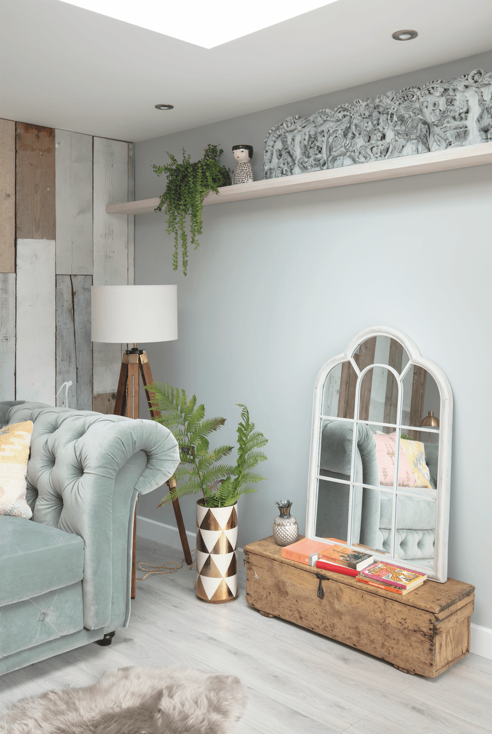 An old low chest brought many years ago at an antiques fair echoes the vintage wood on the back wall and is a handy place to store extra throws for sitting out in the evenings Garden room makeover: 'Vintage touches give our modern garden room character'