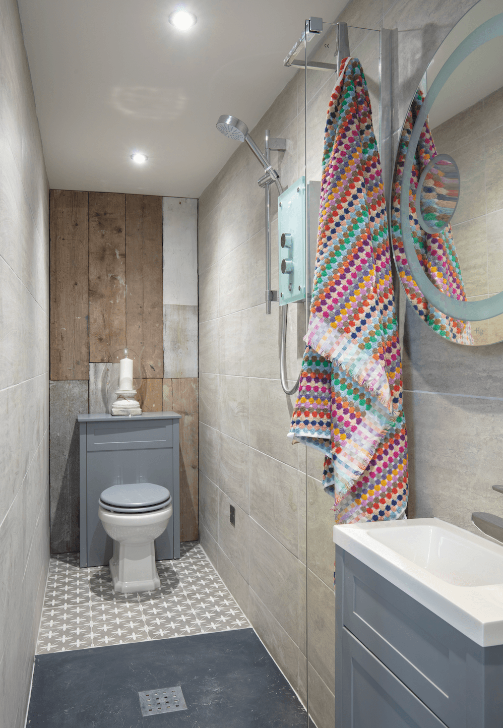 The wet room has the shower in the middle of the space and a screen that folds back to make sure no water escapes to find its way into the main room Garden room makeover: 'Vintage touches give our modern garden room character'