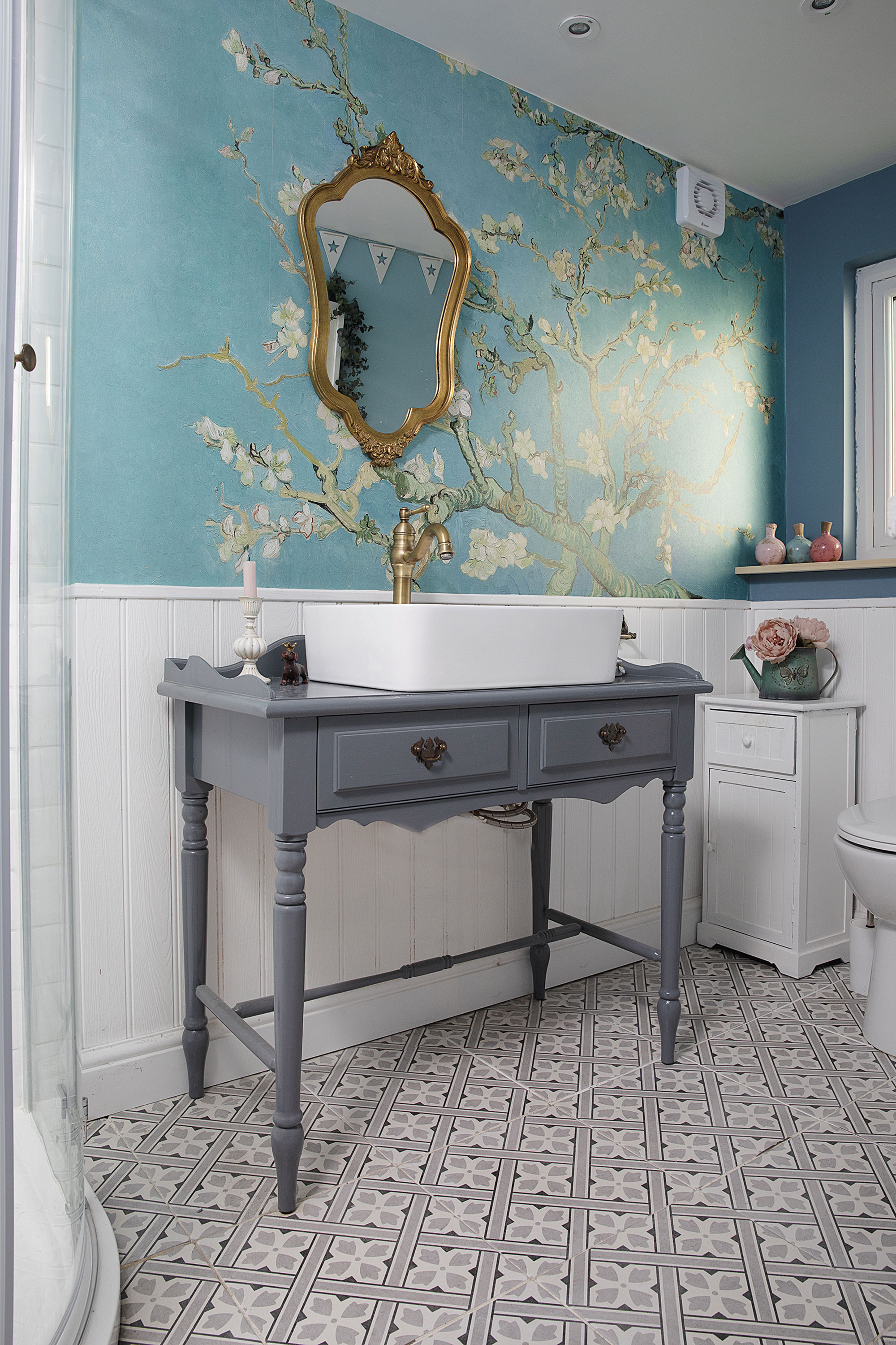 The mural makes a great statement in this small bathroom, adding bold colour and pattern to this small space The mural makes a great statement in this small bathroom, adding bold colour and pattern to this small space