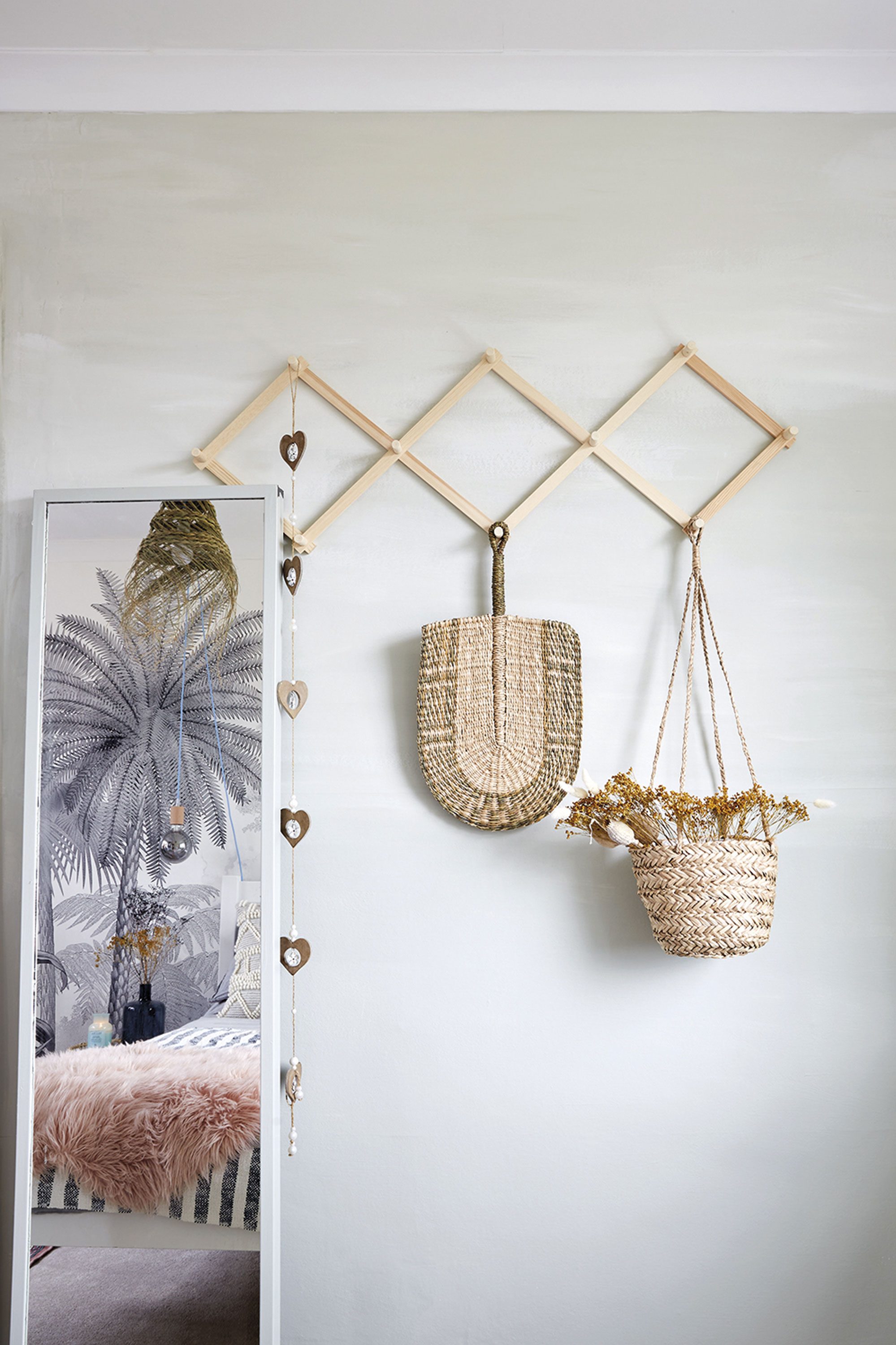 ‘I wanted to create a corner where guests could hang up their clothes to make it feel more homely. The peg rail is from Søstrene Grene. I painted the wall in this soft grey/green shade that’s colour matched to Mizzle by Farrow & Ball’