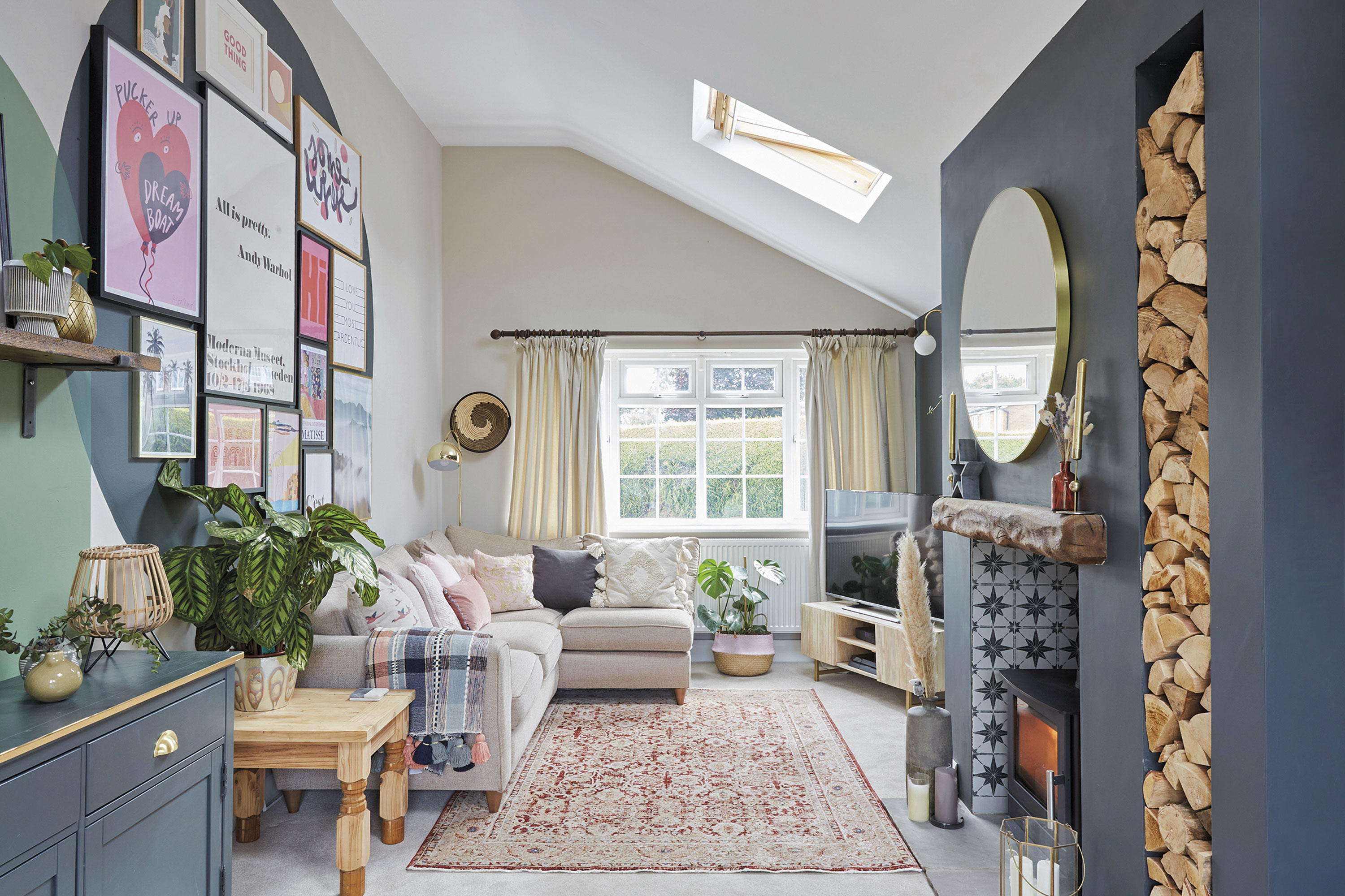 ‘This is a huge living room that runs the full width of the house. It’s lovely and light as it has two good-sized windows and skylights. This also made it hard for me to decide what to do in here. I knew it needed a focal point, so we had the log-burner built and added the log store to create interest’ ‘This is a huge living room that runs the full width of the house. It’s lovely and light as it has two good-sized windows and skylights. This also made it hard for me to decide what to do in here. I knew it needed a focal point, so we had the log-burner built and added the log store to create interest’