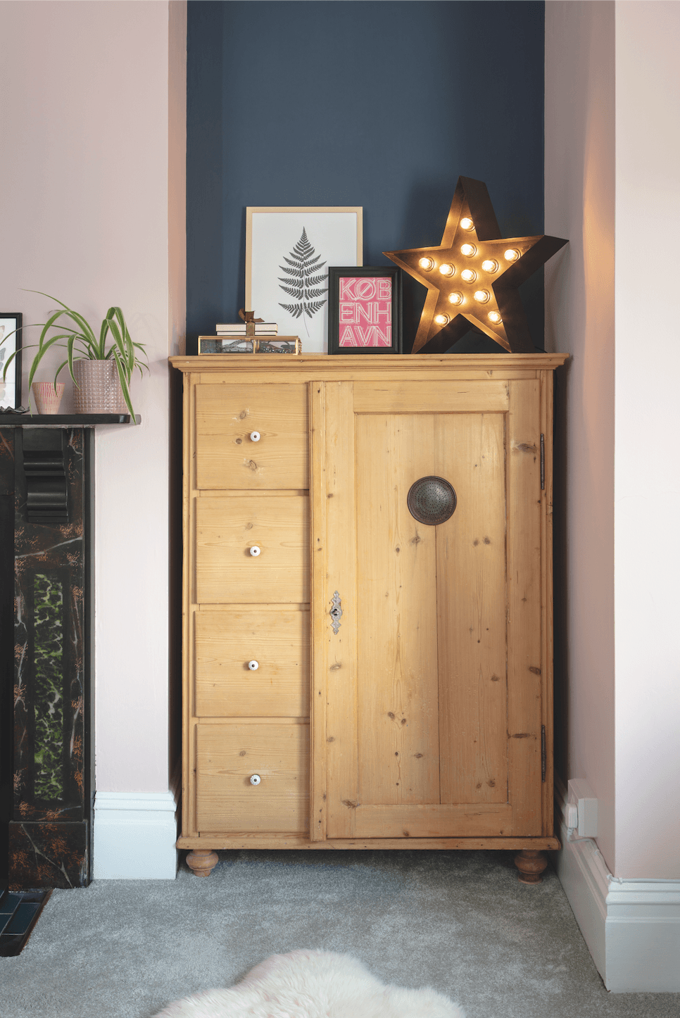 Relocated from another bedroom, this pine cabinet fits snugly into the alcove to provide additional storage Bedroom makeover: 'Reusing old furniture kept our costs down'