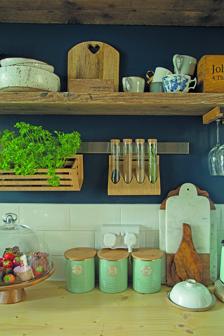 The shelves, which we made from old scaffolding boards, are one of my favourite features in the flat,’ Tosia says. ‘They’re home to my handmade dining sets from Christina Gascoigne, a small pottery studio in Richmond, and an old wooden tea box that dates back to 1930, which I found at a car boot.’