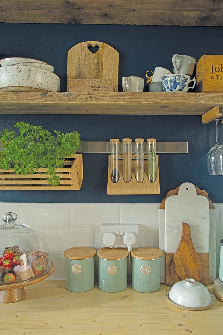kitchen 4 The shelves, which we made from old scaffolding boards, are one of my favourite features in the flat,’ Tosia says. ‘They’re home to my handmade dining sets from Christina Gascoigne, a small pottery studio in Richmond, and an old wooden tea box that dates back to 1930, which I found at a car boot.’