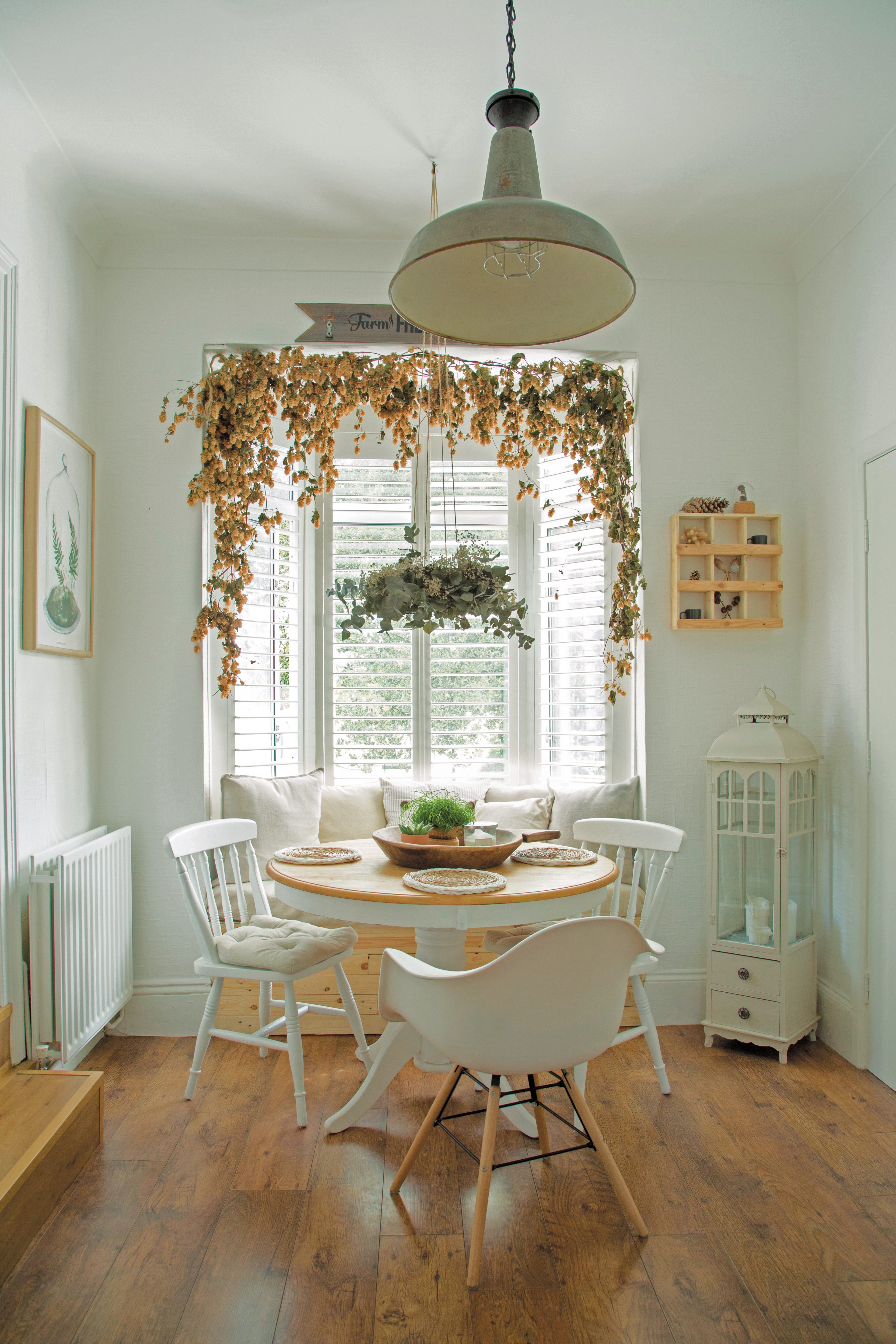 dining room 6 To make better use of available space, Tomasz built a cupboard that doubles as a dining seat in the bay window. The shutters were bought second-hand and, unlike curtains, keep the room from feeling crowded