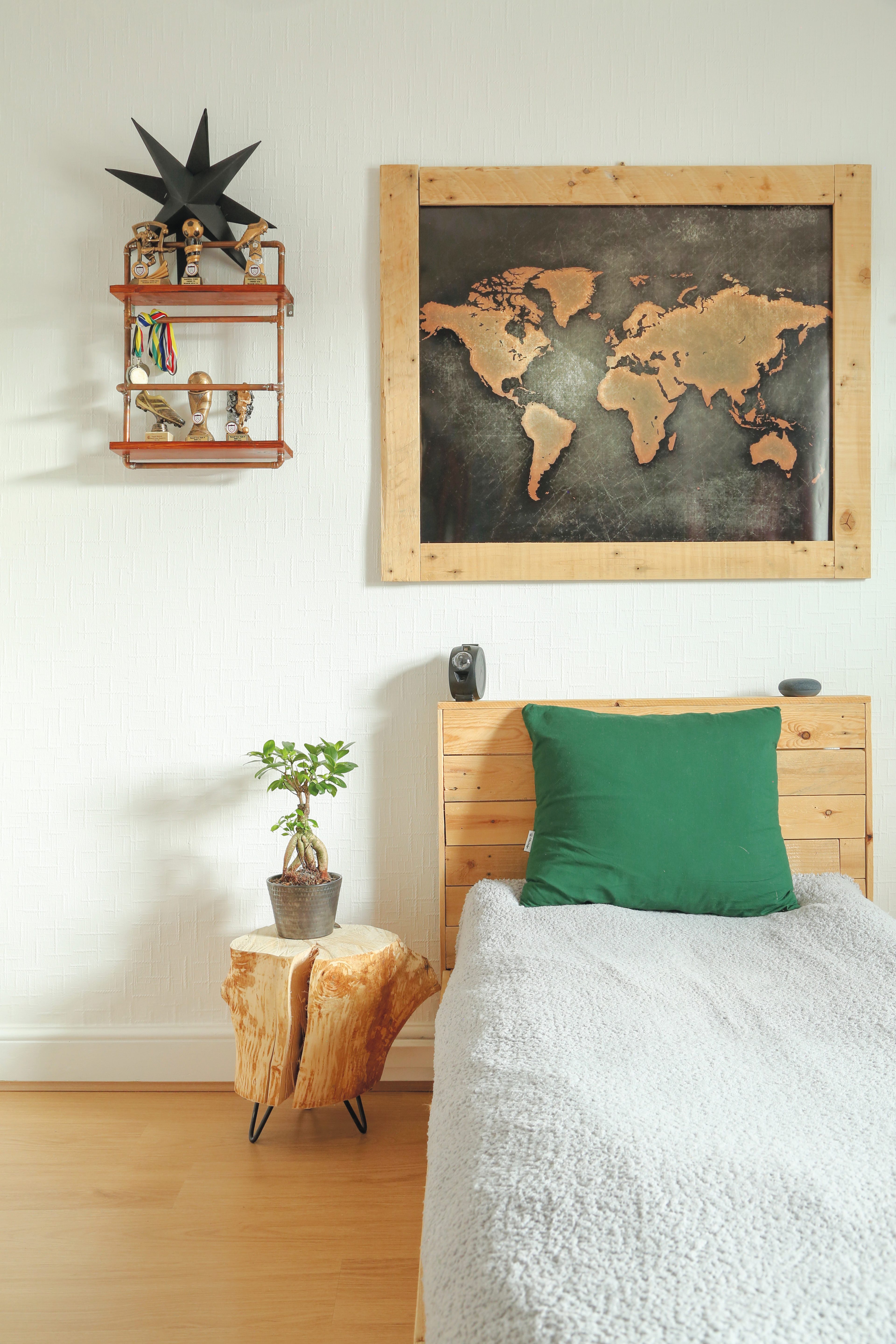 sons room 2 ‘Tomasz built David’s bed from planks of wood and made the shelving either side of his bed from copper pipes and wood scraps,’ Tosia says
