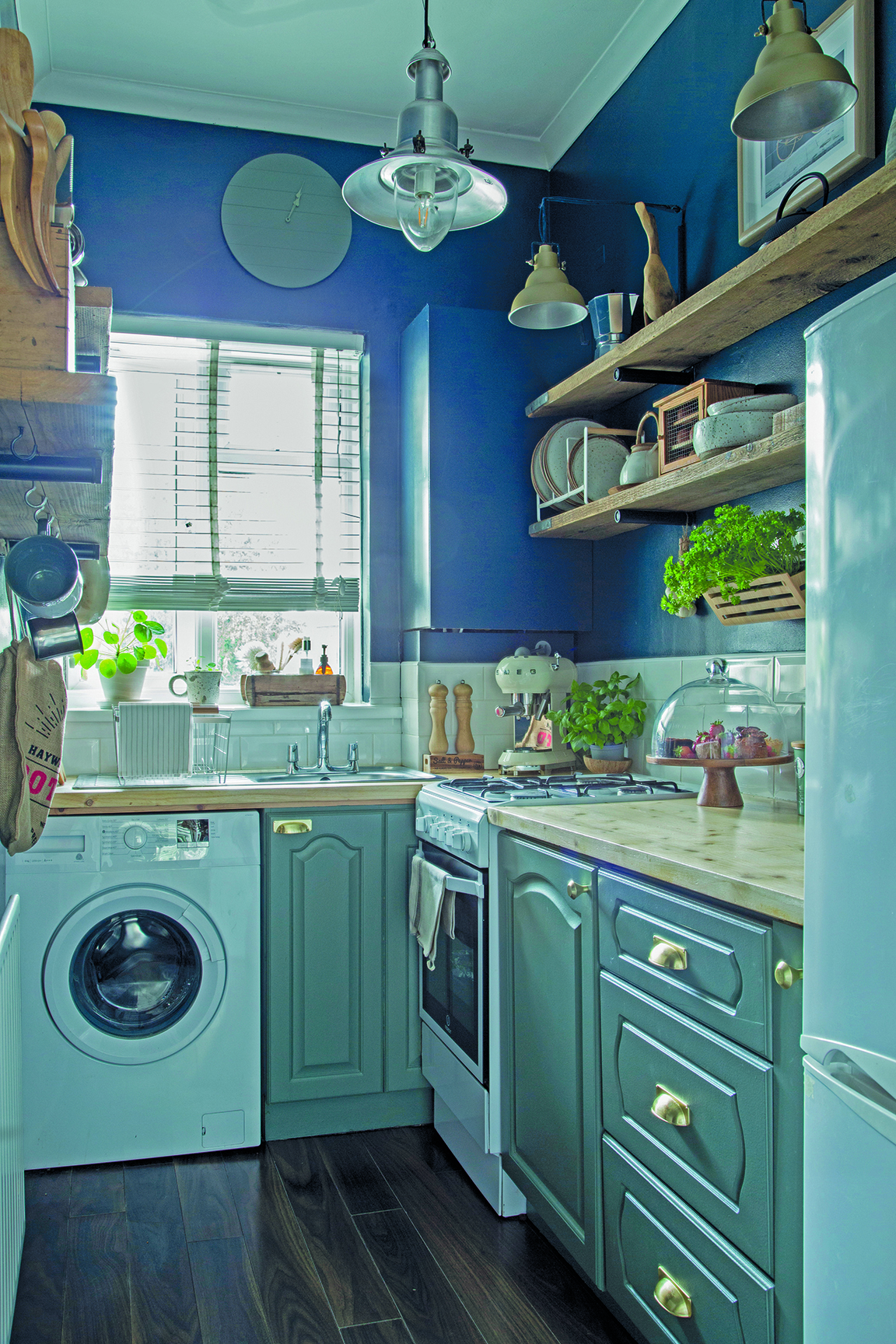 Together, the teal, navy and raw wood tones create a kitchen scheme that feels classic, yet contemporary, as well as rustic and relaxed
