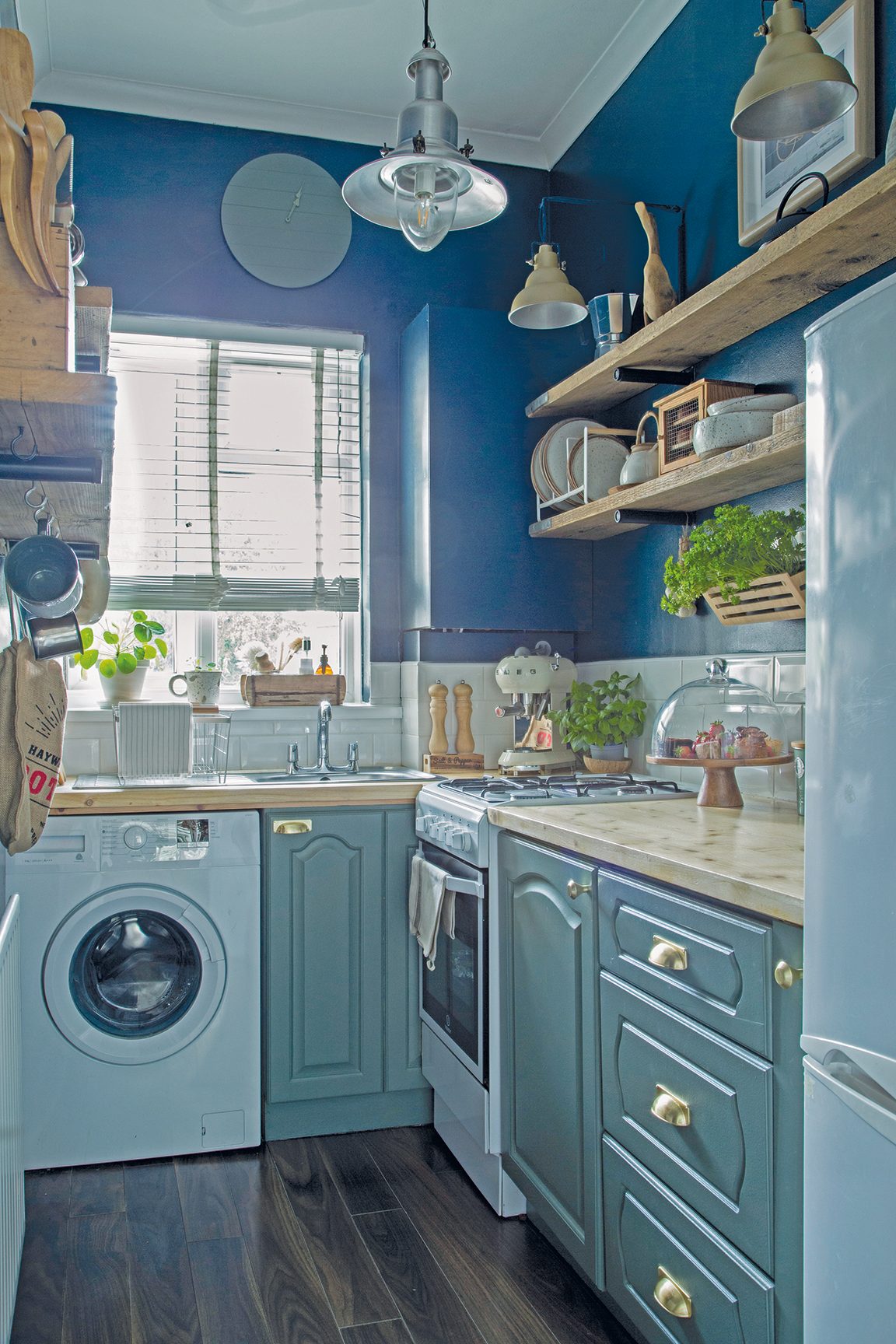 kitchen 1 Together, the teal, navy and raw wood tones create a kitchen scheme that feels classic, yet contemporary, as well as rustic and relaxed