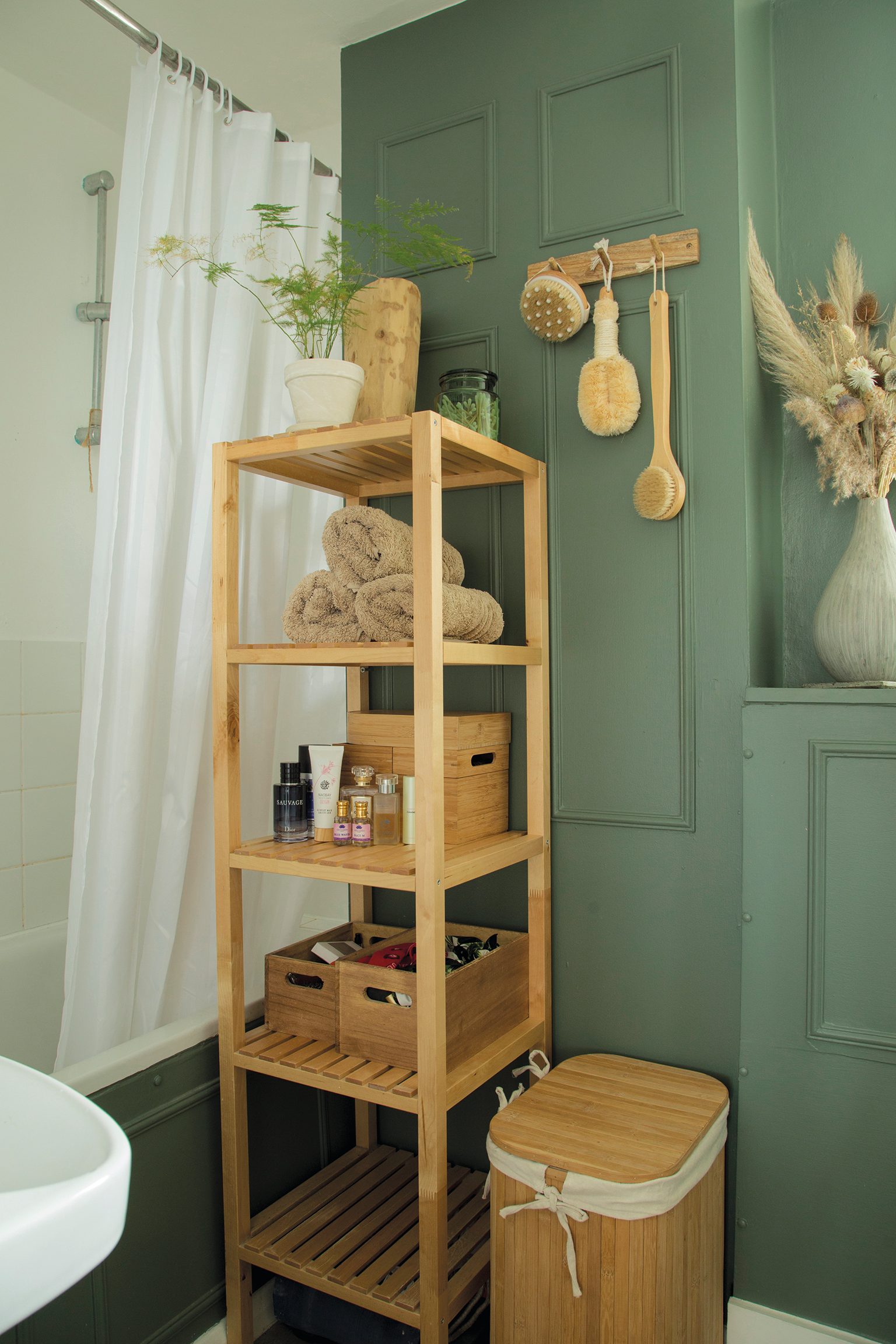bathroom 2 Wooden accessories against a backdrop of Farrow & Ball’s Green Smoke creates a Scandinavian-style woodland vibe