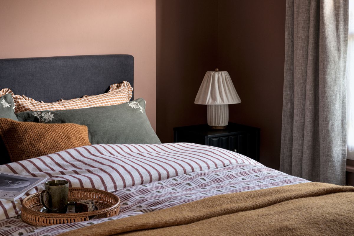 Bed with quilt and coffee and tray on it