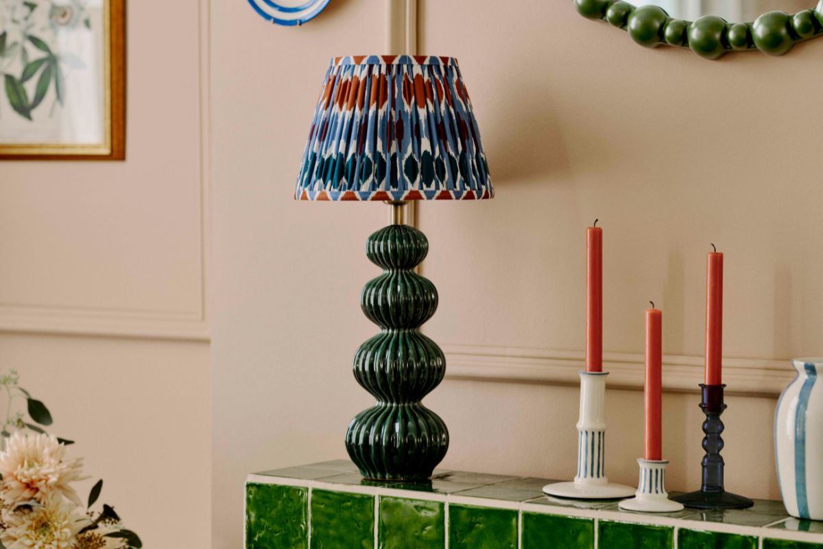 Matthew Williamson bobbin round wall mirror in Green, £199; ribbed ceramic table lamp, £85; Narla shade in Multi, from £50; ANYDAY Blue stripe candle holders, from £8; glass bobbin candle holder, £12; striped stoneware vase in
Haze Blue, £15, all John Lewis & Partners