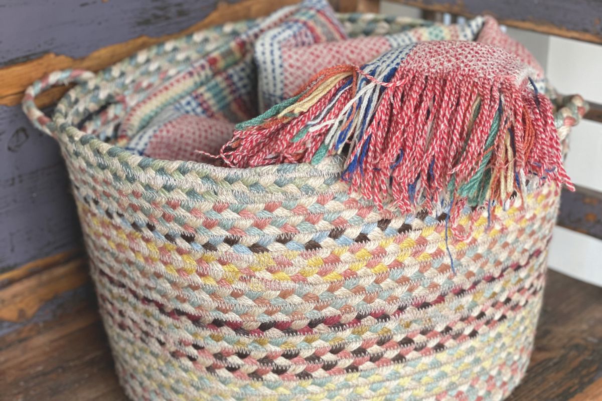 A basket with blankets in it