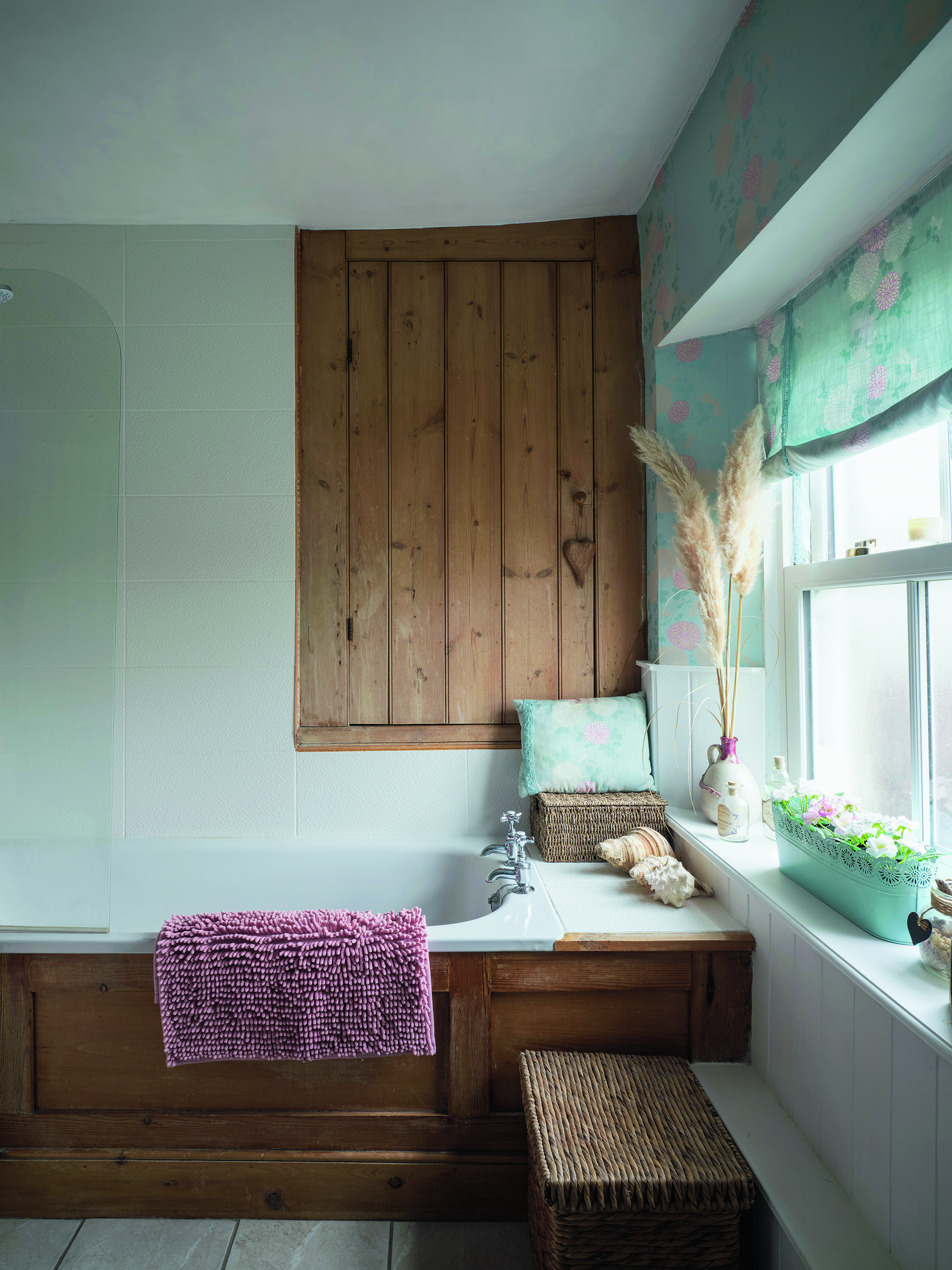 Ali and Gary loved the warm wood tones throughout the house, so they kept a lot of the existing woodwork. In the family bathroom, Ali has lifted it with pastels so it feels light and bright Ali and Gary loved the warm wood tones throughout the house, so they kept a lot of the existing woodwork. In the family bathroom, Ali has lifted it with pastels so it feels light and bright