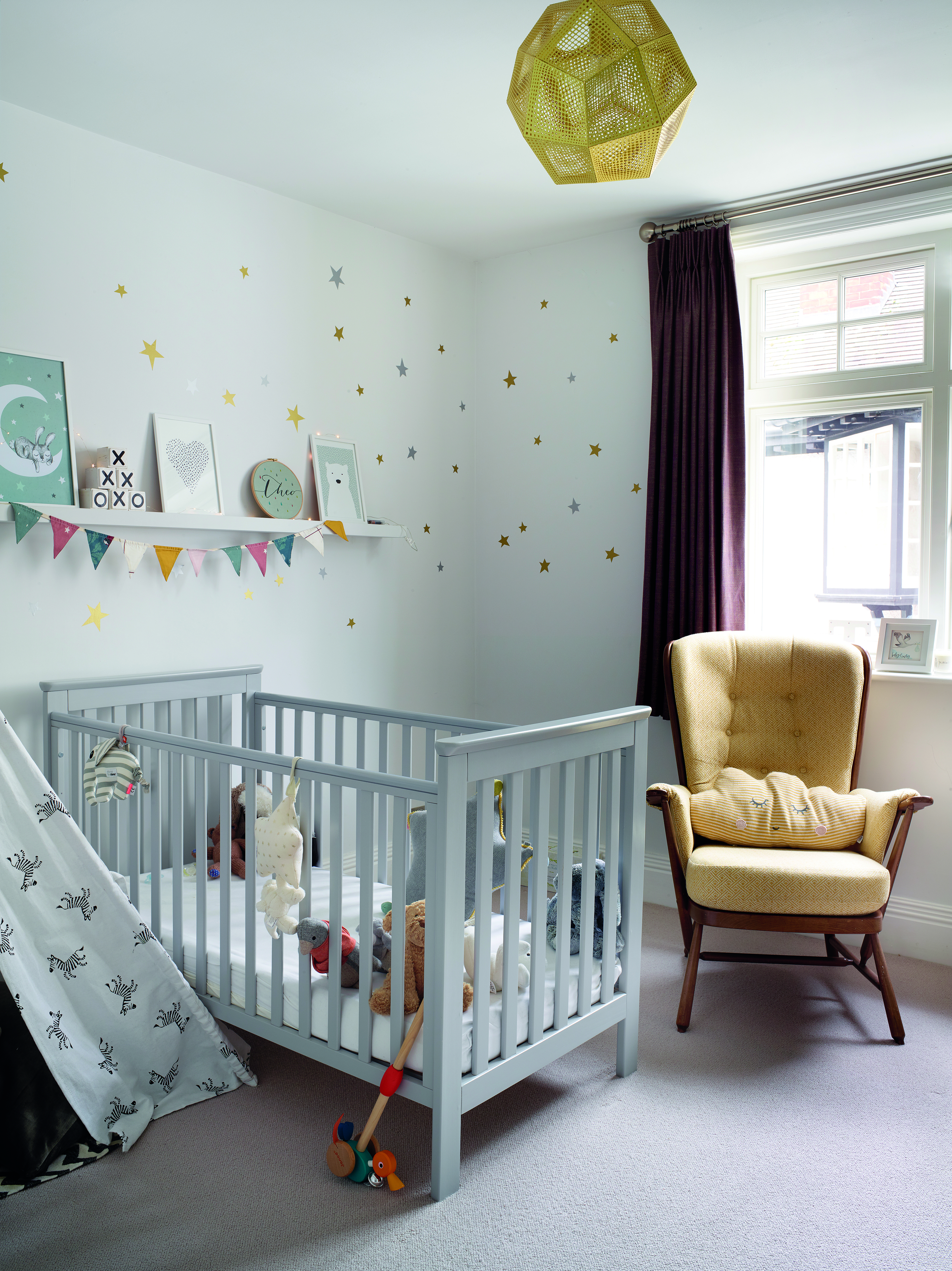 ‘I didn’t want to spend a lot on Theo’s room as he’ll grow out of it. I used decals on a neutral wall and added prints, bunting and fairy lights for texture and interest’ says Sarah ‘I didn’t want to spend a lot on Theo’s room as he’ll grow out of it. I used decals on a neutral wall and added prints, bunting and fairy lights for texture and interest’ says Sarah