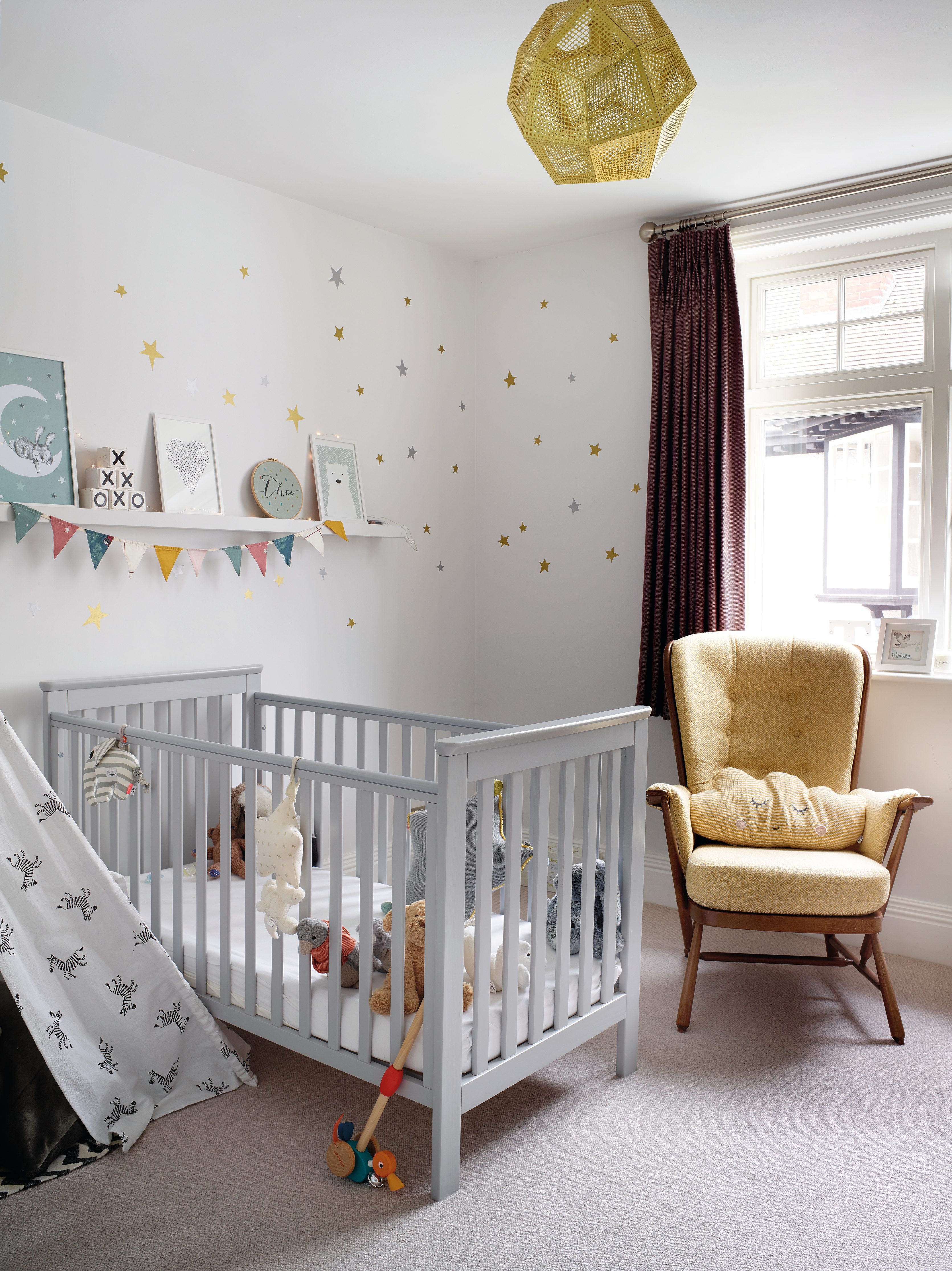 ‘I didn’t want to spend a lot on Theo’s room as he’ll grow out of it. I used decals on a neutral wall and added prints, bunting and fairy lights for texture and interest’ says Sarah ‘I didn’t want to spend a lot on Theo’s room as he’ll grow out of it. I used decals on a neutral wall and added prints, bunting and fairy lights for texture and interest’ says Sarah