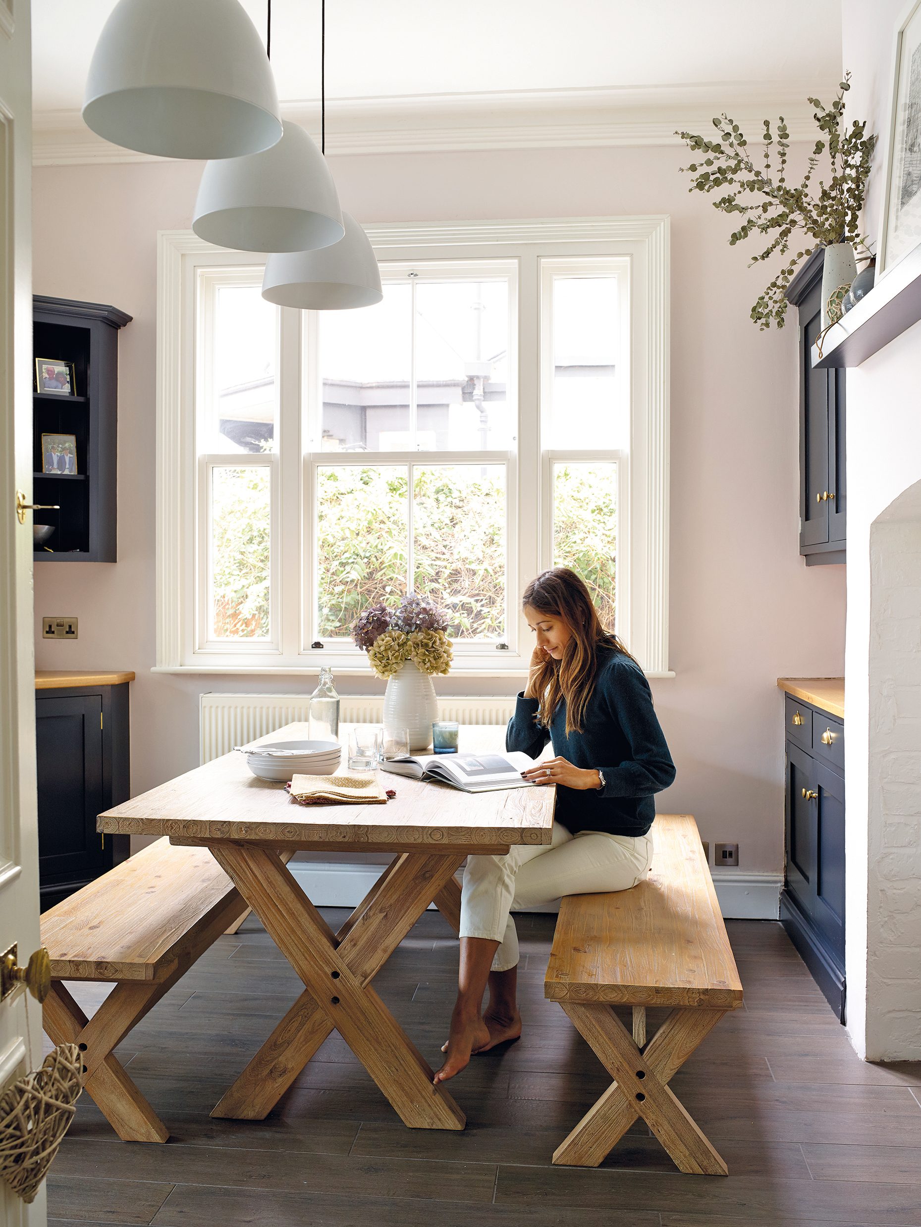 The Kettler Elba garden picnic dining table and chairs from John Lewis & Partners add a farmhouse feel to the kitchen. The built-in cabinetry was made by local firm Steve Hills Design and has been painted in Farrow & Ball Railings The Kettler Elba garden picnic dining table and chairs from John Lewis & Partners add a farmhouse feel to the kitchen. The built-in cabinetry was made by local firm Steve Hills Design and has been painted in Farrow & Ball Railings