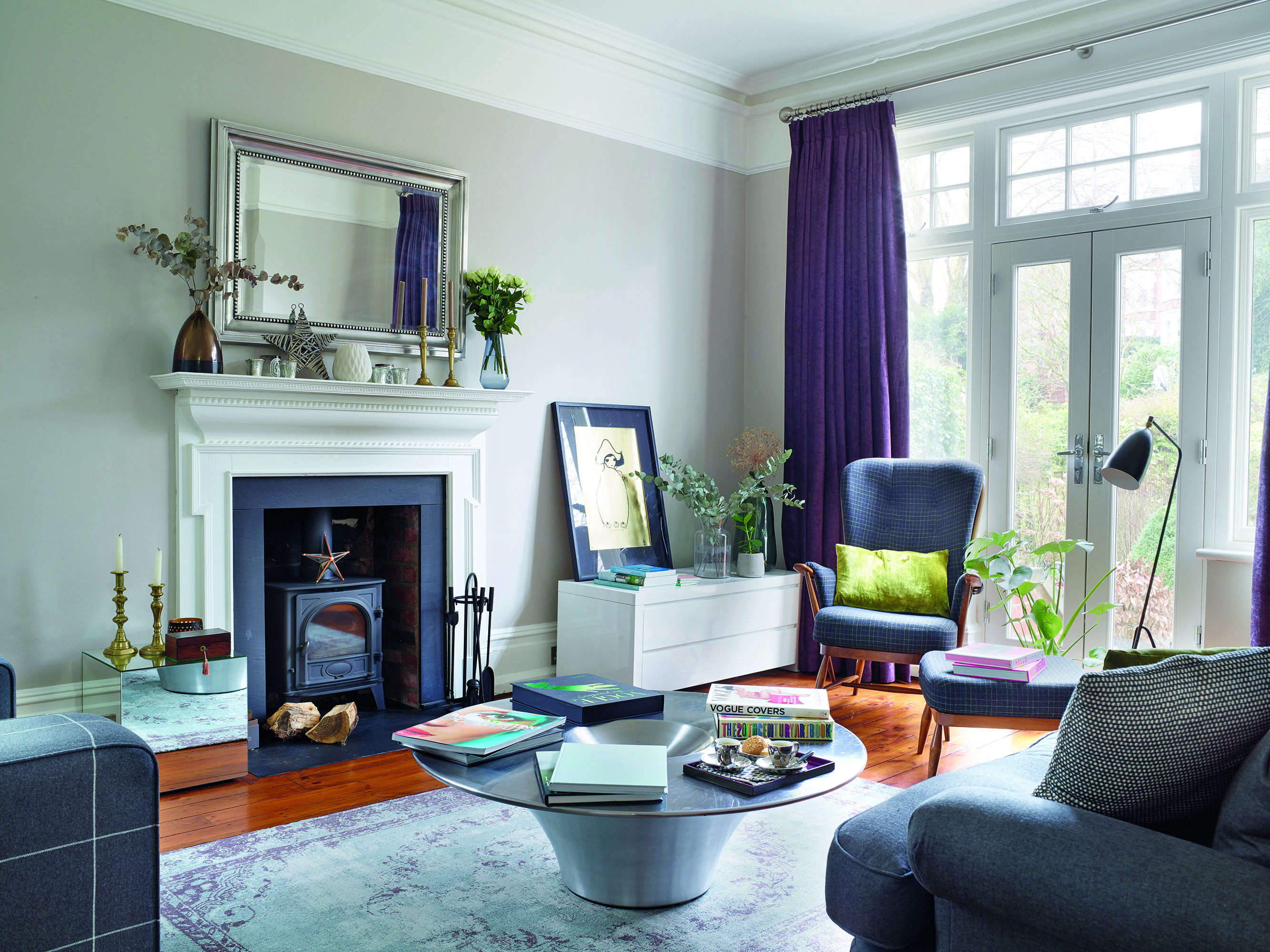 The coffee table and armchairs are from a now-defunct interiors store called Nash Interiors, but for similar accent armchairs you could try the Kubrick wing back design from Made.com. The Strata rug from Cox & Cox adds warmth to the wooden floors, while the curtains, in Forenza Blackberry cotton velvet by Romo, bring a pop of colour The coffee table and armchairs are from a now-defunct interiors store called Nash Interiors, but for similar accent armchairs you could try the Kubrick wing back design from Made.com. The Strata rug from Cox & Cox adds warmth to the wooden floors, while the curtains, in Forenza Blackberry cotton velvet by Romo, bring a pop of colour