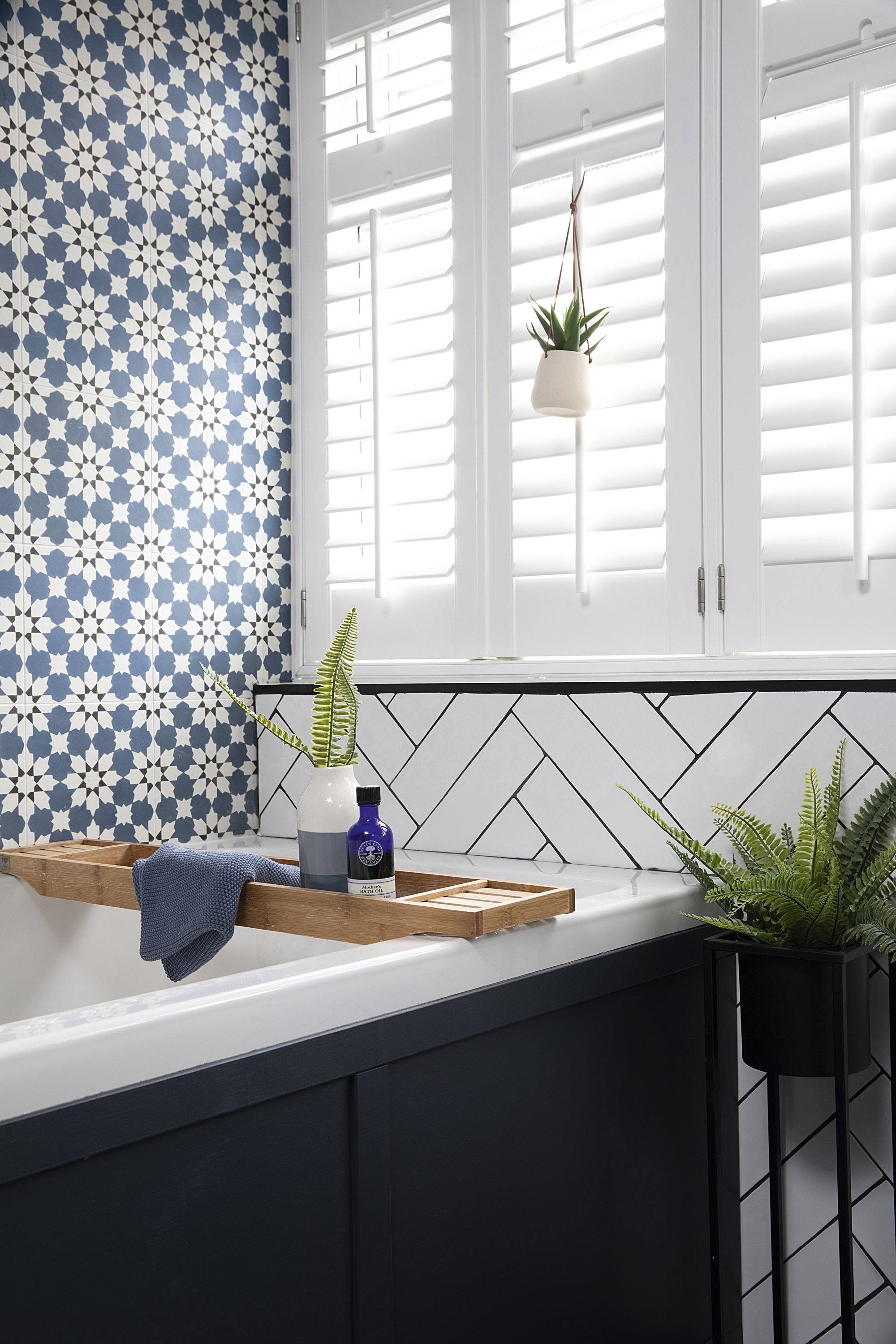 It’s the subtle touches as well as the statement tiles that give Claire’s scheme a holiday feel, including white window shutters and plants and succulents dotted around the space
