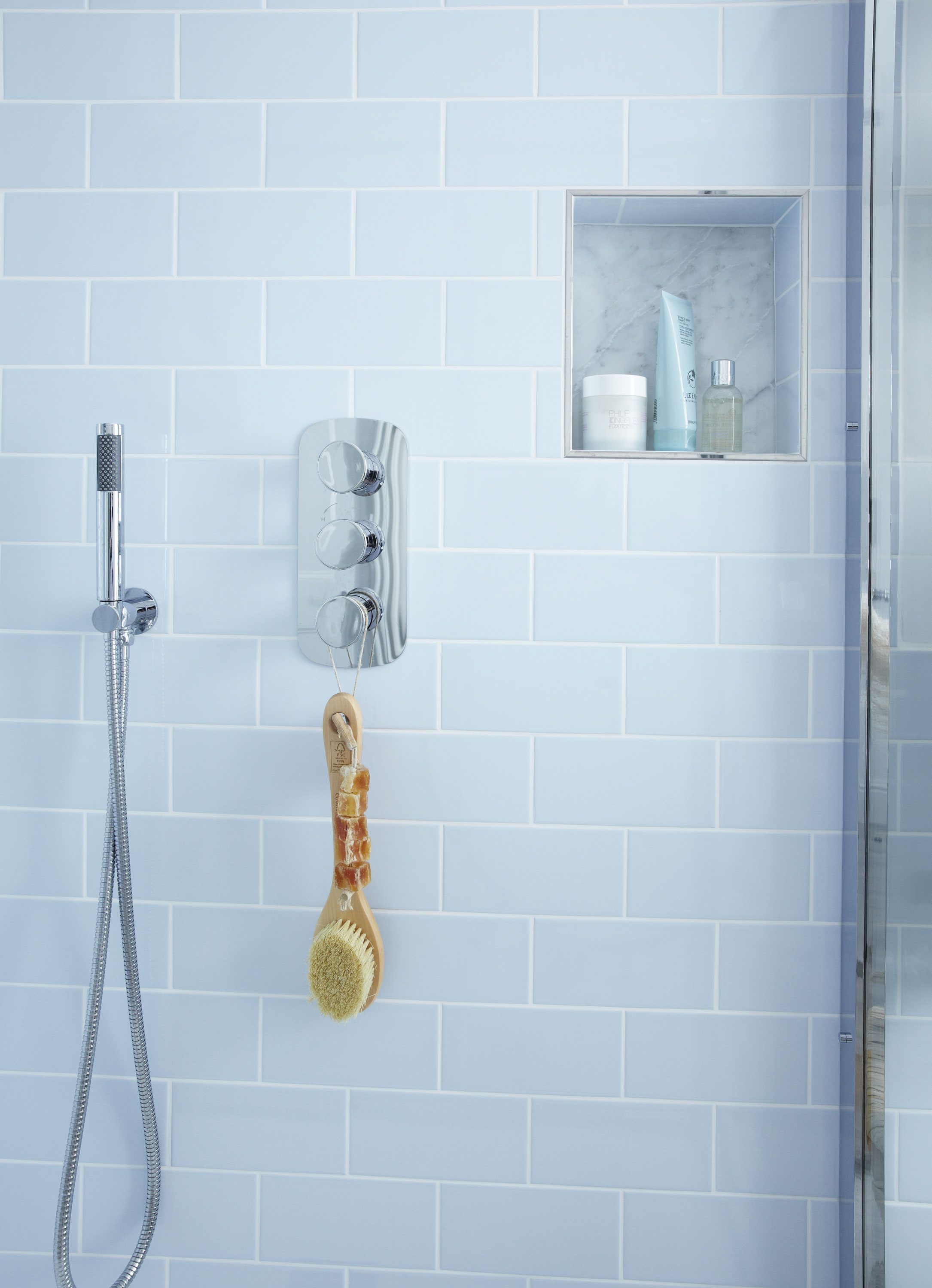 Laura wisely teamed her fixed overhead shower with a secondary hand-held model to ensure the enclosure can be easily washed down – an idea she repeated for the bath Laura wisely teamed her fixed overhead shower with a secondary hand-held model to ensure the enclosure can be easily washed down – an idea she repeated for the bath