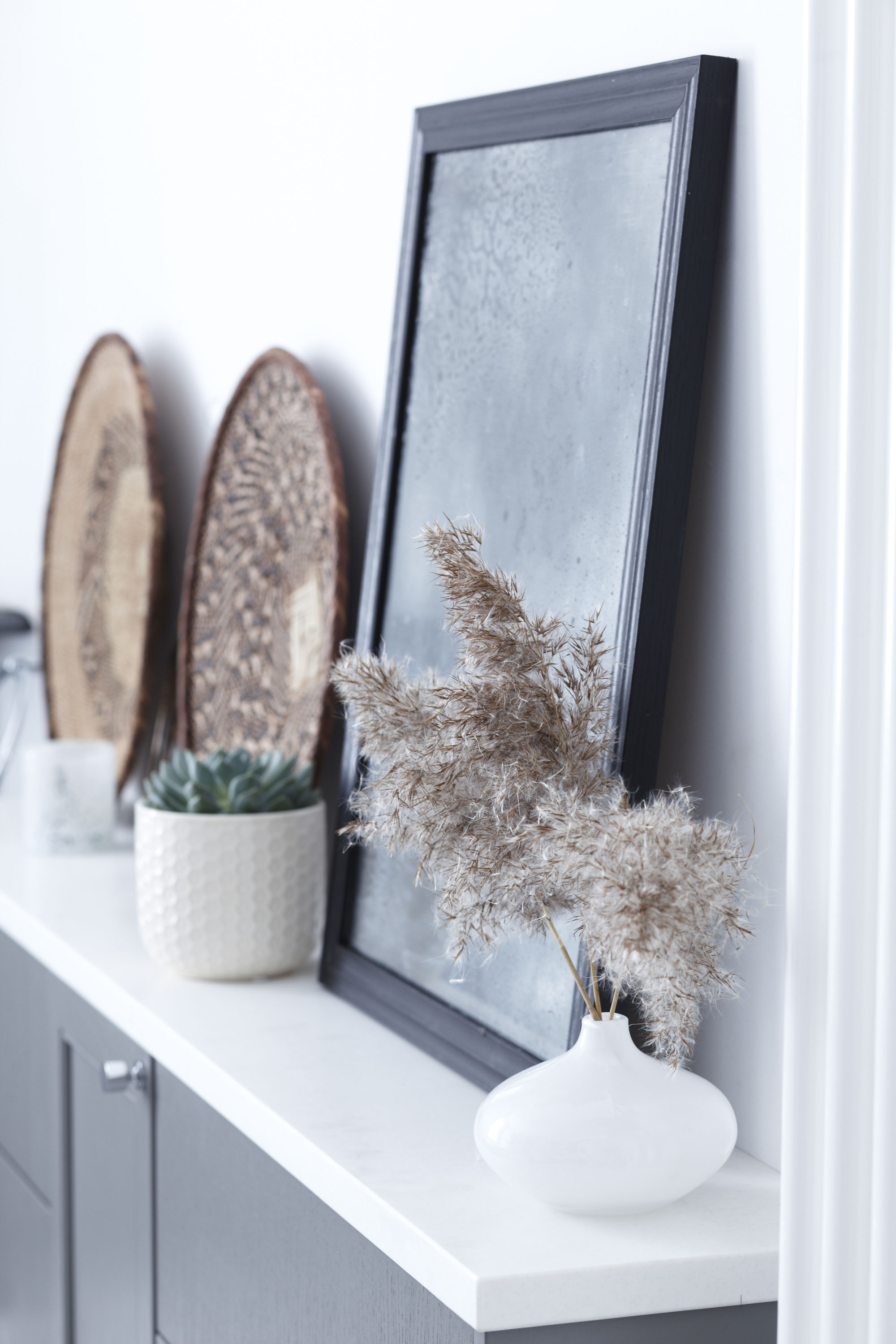A collection of holiday souvenirs and second-hand finds add a personal touch to this much-used room