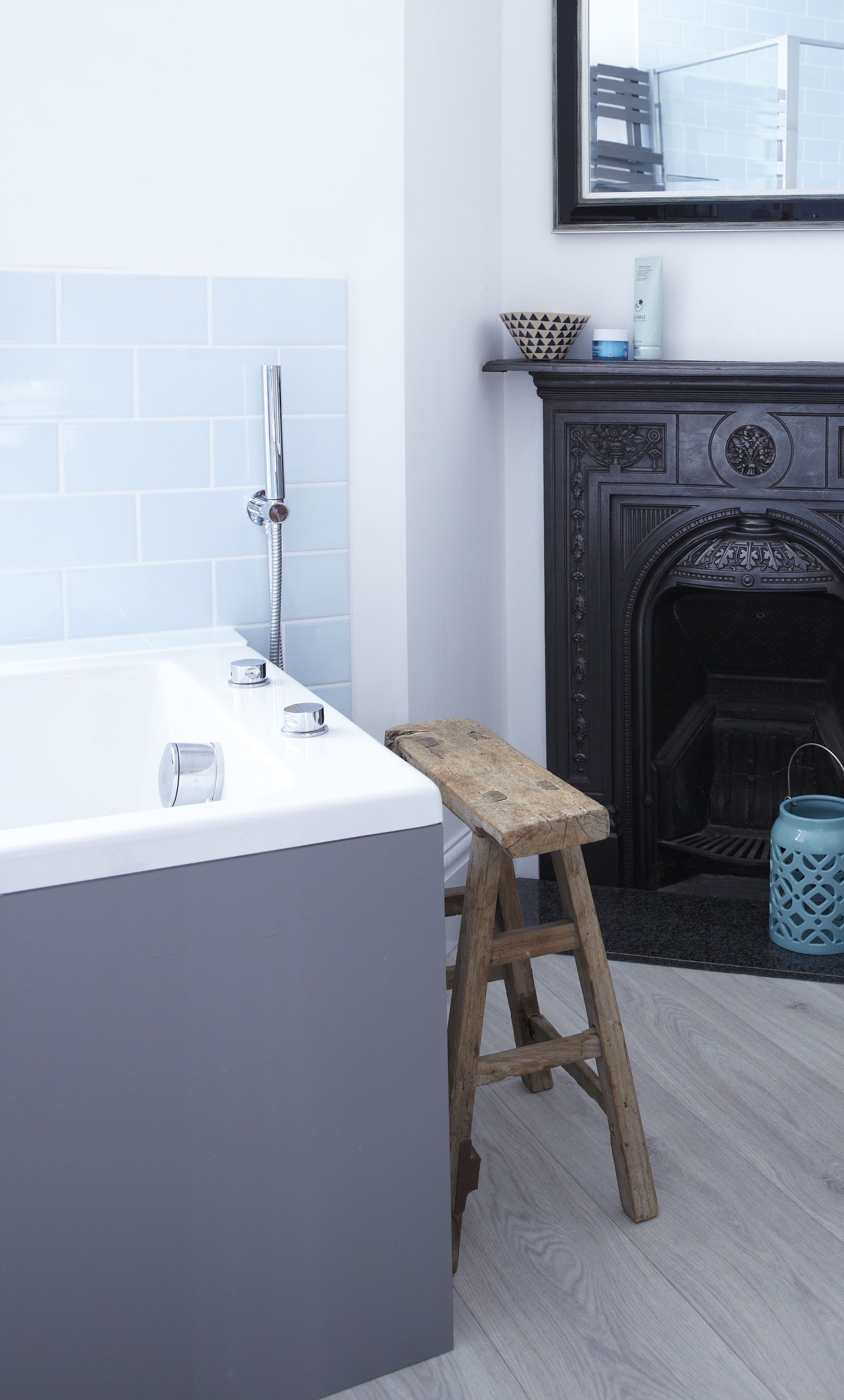 Laura was determined to keep the room’s original fireplace, while the addition of a vintage stool provides a handy spot to store clothes and magazines Laura was determined to keep the room’s original fireplace, while the addition of a vintage stool provides a handy spot to store clothes and magazines