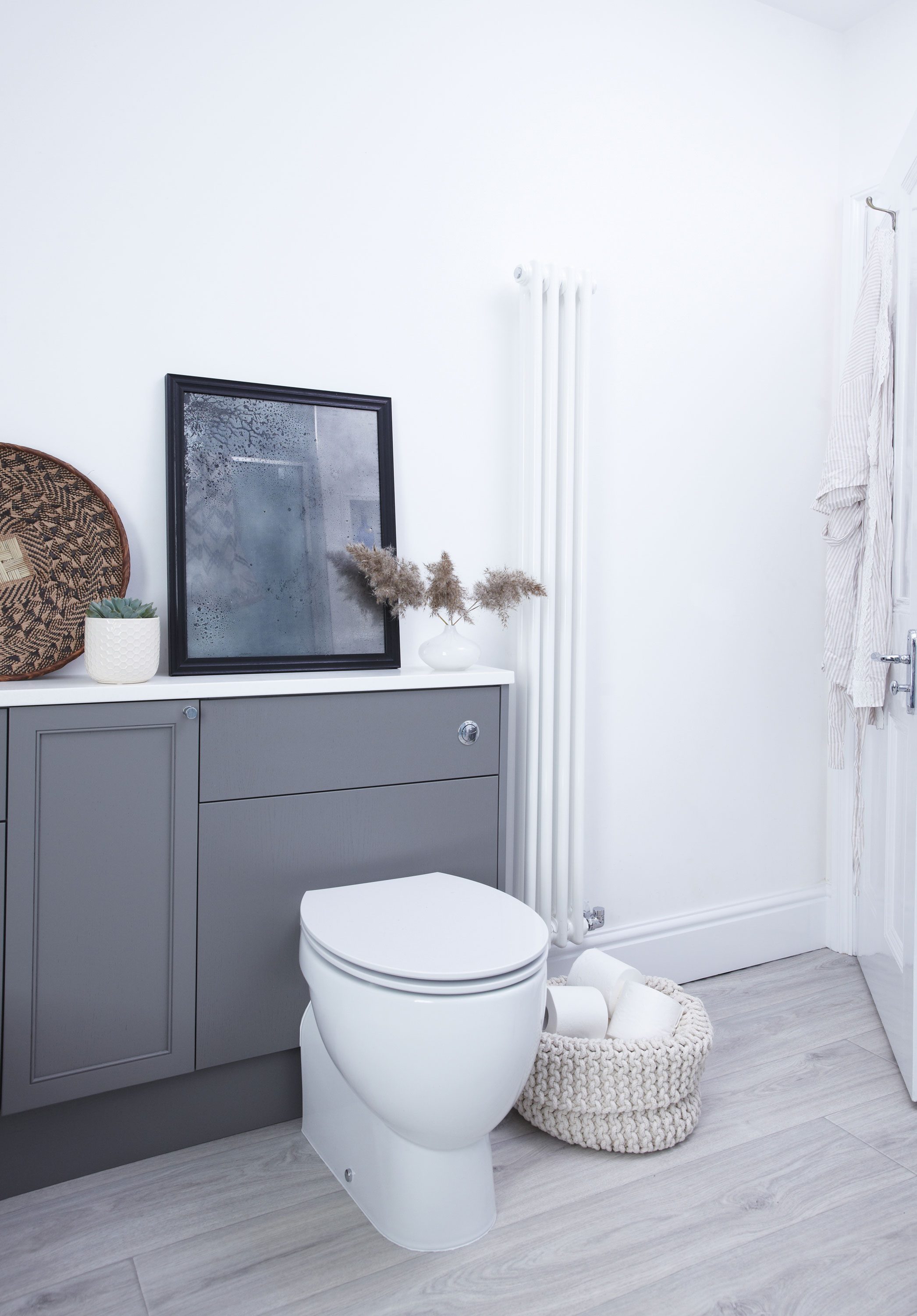 Laura chose fitted units that not only offered plenty of storage and display space, but also allowed for the toilet cistern to be seamlessly integrated Laura chose fitted units that not only offered plenty of storage and display space, but also allowed for the toilet cistern to be seamlessly integrated