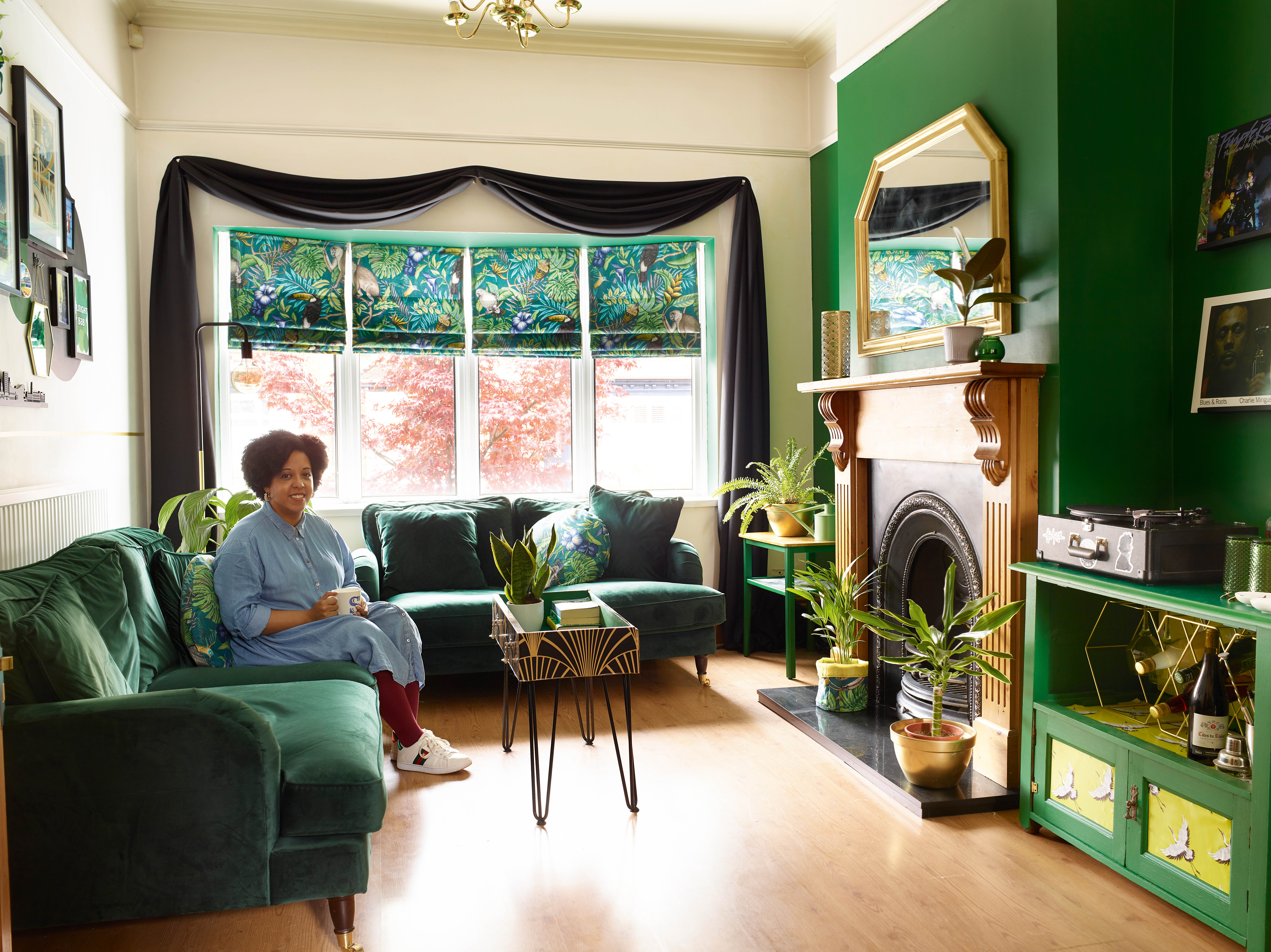 Sabrina in her green living room