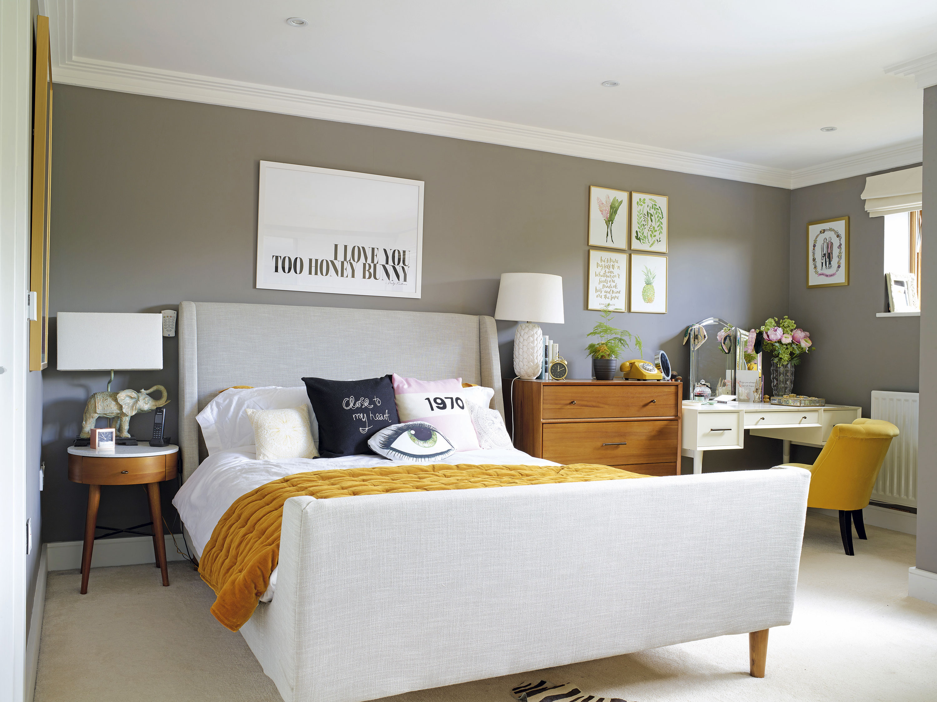 ‘I think it’s easier to make fewer mistakes when you go for a neutral backdrop,’ shares Sam. ‘I love the deep moody grey of these walls; it really makes the art pop’ ‘I think it’s easier to make fewer mistakes when you go for a neutral backdrop,’ shares Sam. ‘I love the deep moody grey of these walls; it really makes the art pop’
