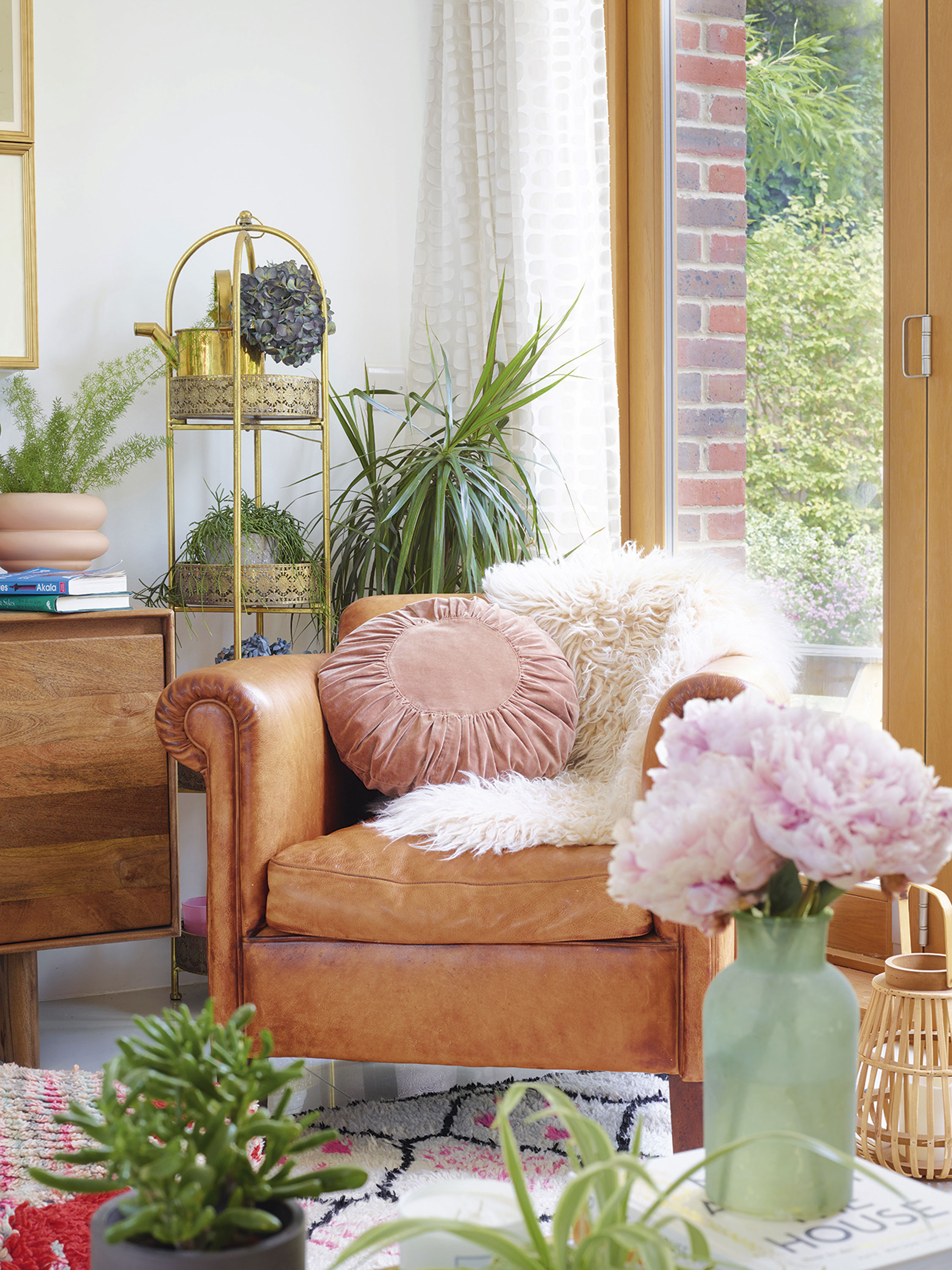 Sam creates beautifully styled spaces using layers of soft and natural textures. The leather chair is from John Lewis & Partners, while the tiered shelf is from Graham & Green Sam creates beautifully styled spaces using layers of soft and natural textures. The leather chair is from John Lewis & Partners, while the tiered shelf is from Graham & Green