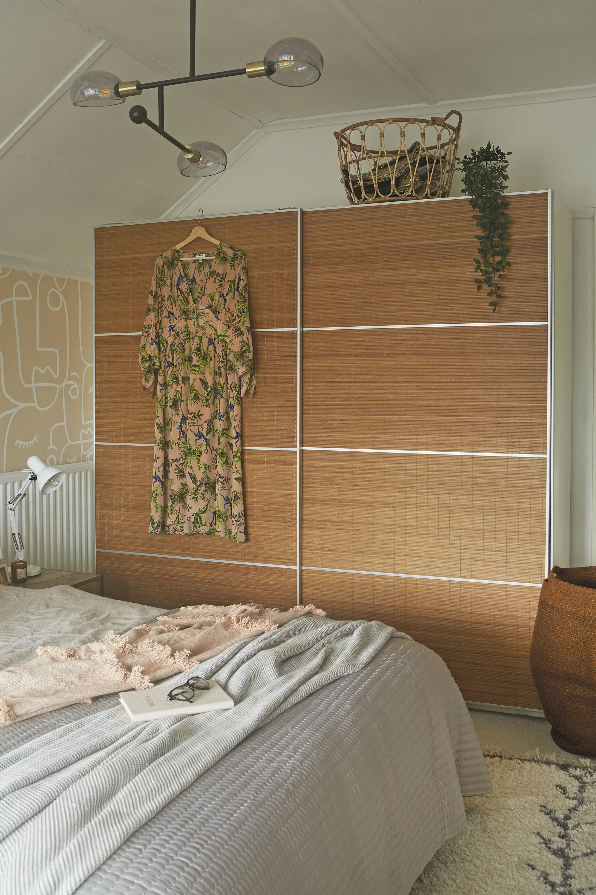 Ideally the couple would have liked to replace their old wardrobe with a built-in design, but it would have meant moving the radiator. Instead, they updated it with new bamboo panels from IKEA, which gave the wardrobe an entirely new look and helped keep costs down Ideally the couple would have liked to replace their old wardrobe with a built-in design, but it would have meant moving the radiator. Instead, they updated it with new bamboo panels from IKEA, which gave the wardrobe an entirely new look and helped keep costs down