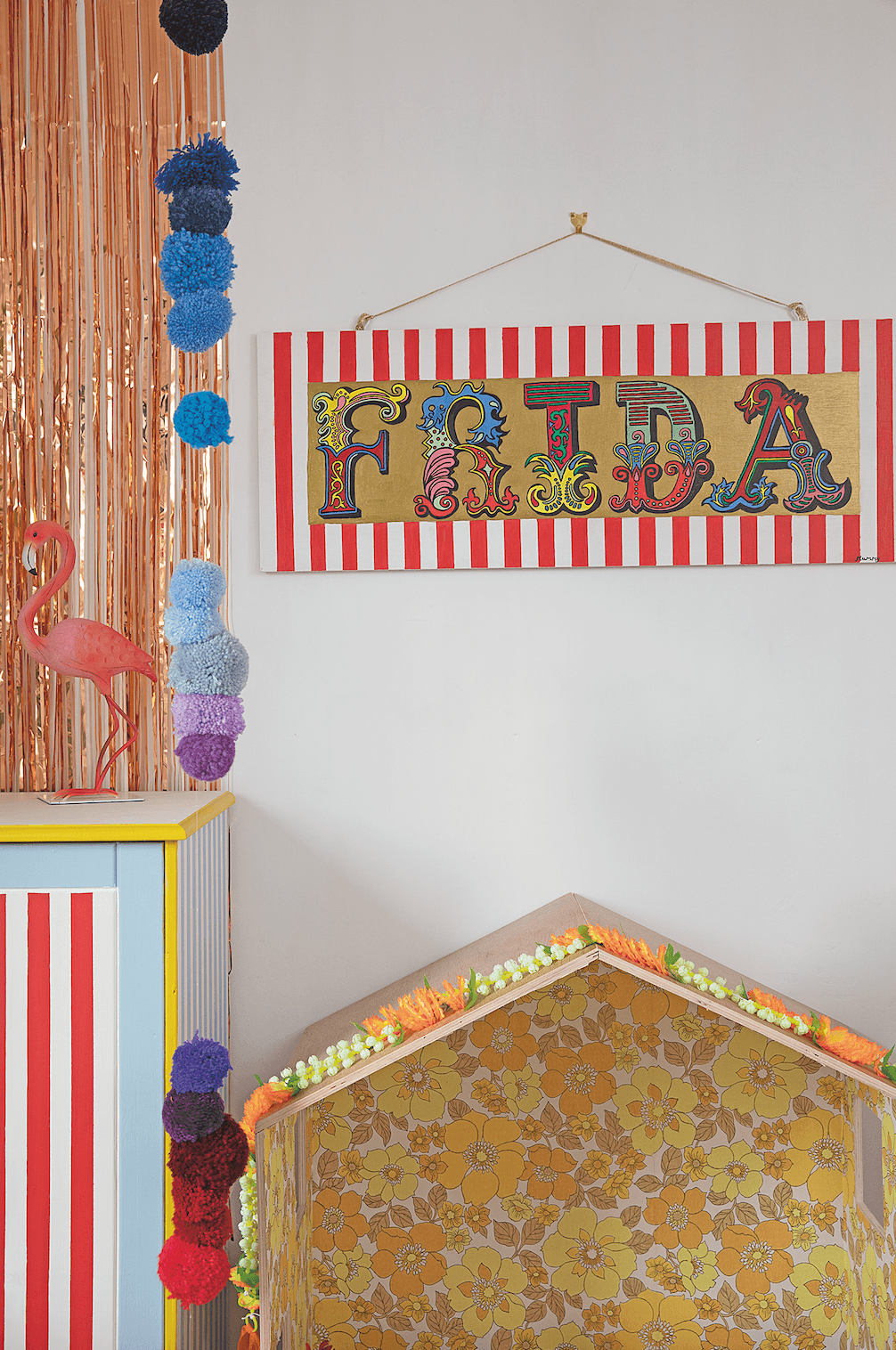 Suzy painted a new circus name sign for Frida. It was made from scrap plywood she got free from B&Q and leftover paint. She also sells similar customised signs on her website Bedroom makeover: 'Getting creative on a budget is my passion'