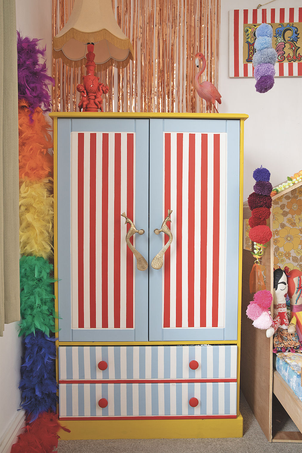 As Frida loves dressing up, she adores her compact upcycled wardrobe because she can reach her own clothes and choose what she wants to wear every day. The foil fringing above was from Aldi and adds bit of sparkle against the white walls Bedroom makeover: 'Getting creative on a budget is my passion'