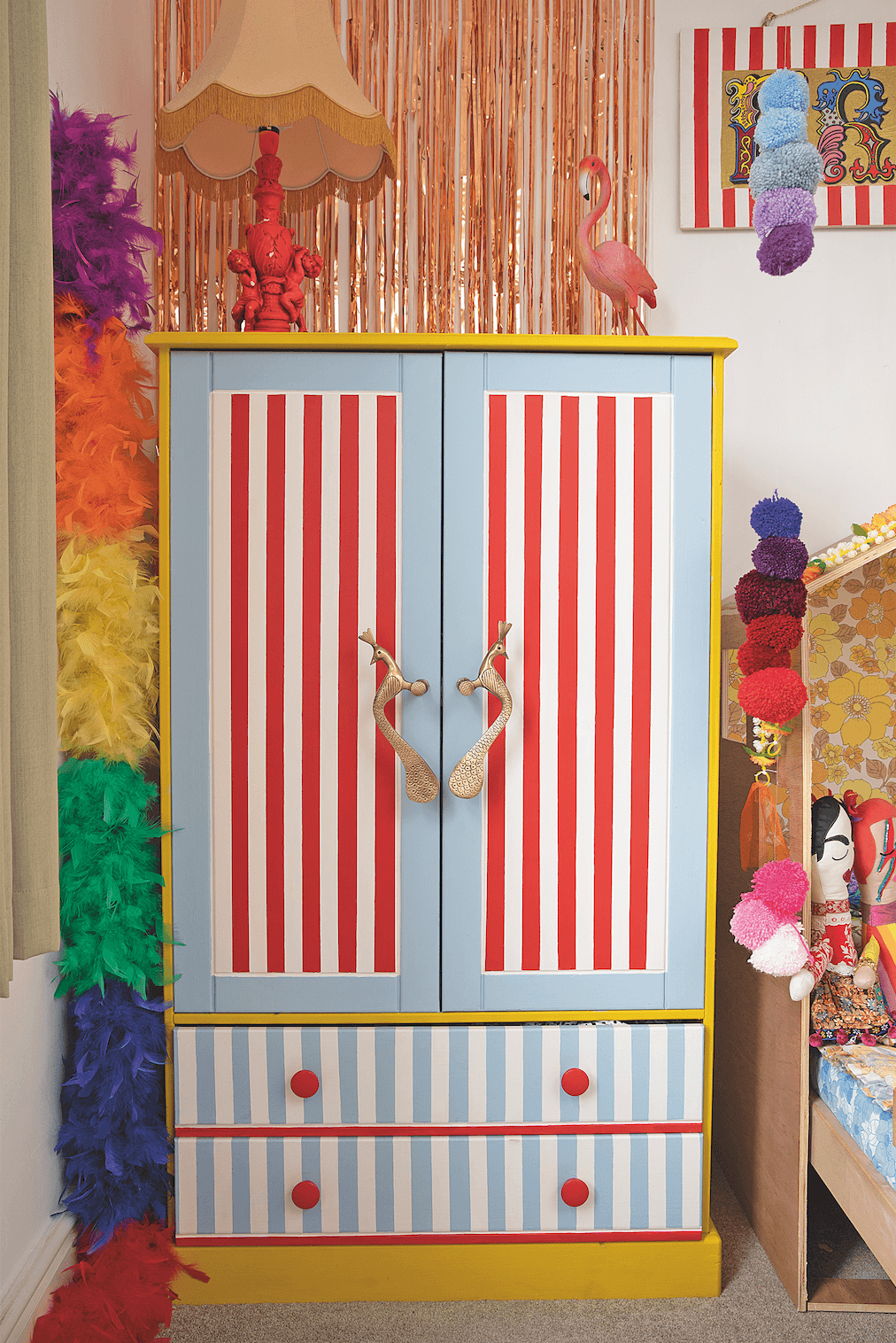 As Frida loves dressing up, she adores her compact upcycled wardrobe because she can reach her own clothes and choose what she wants to wear every day. The foil fringing above was from Aldi and adds bit of sparkle against the white walls Bedroom makeover: 'Getting creative on a budget is my passion'