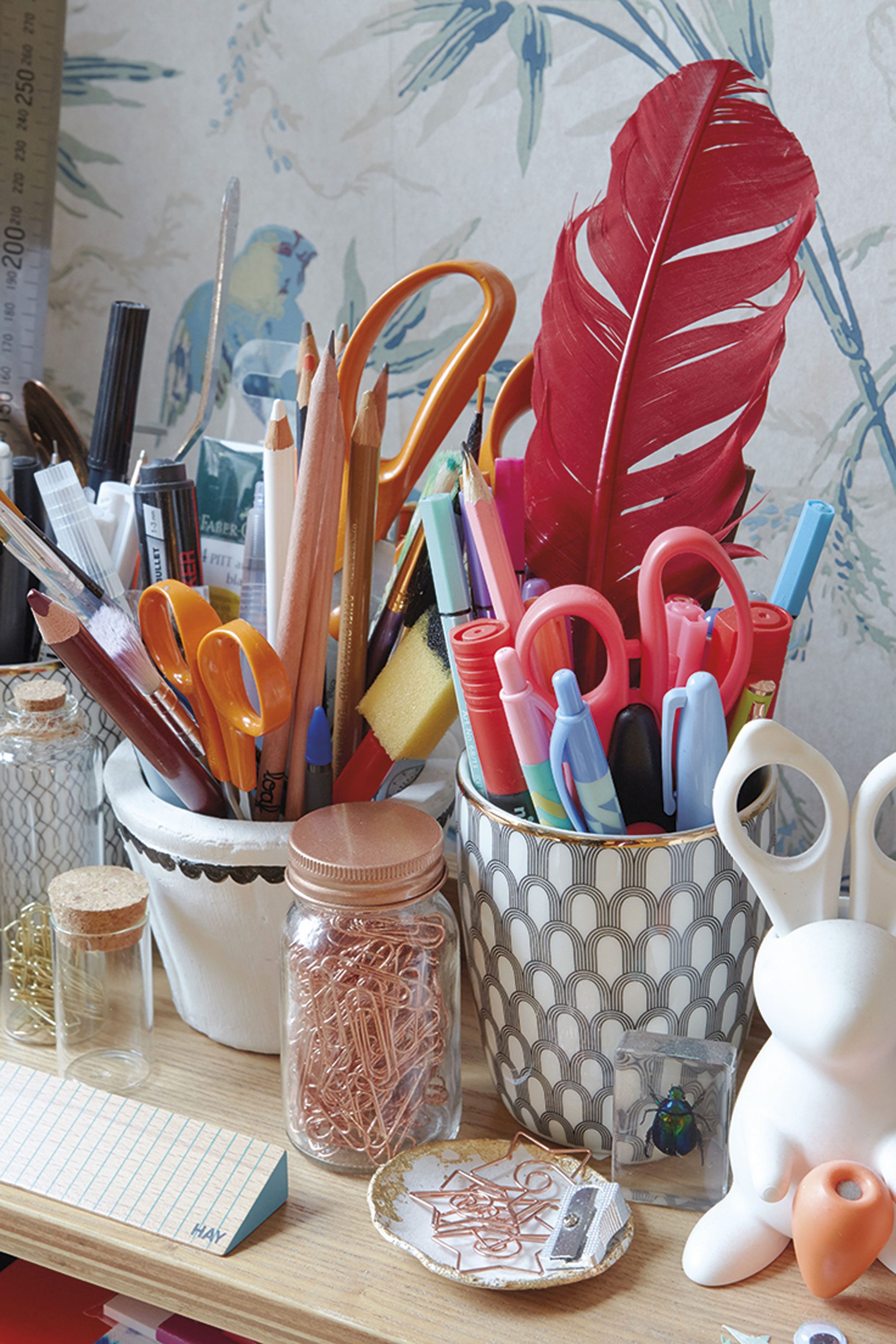 Emily’s desk holds an assorted mix of craft equipment. ‘I teach calligraphy and brush lettering, so I have a lot of quills, ink and pens,’ says Emily Emily’s desk holds an assorted mix of craft equipment. ‘I teach calligraphy and brush lettering, so I have a lot of quills, ink and pens,’ says Emily