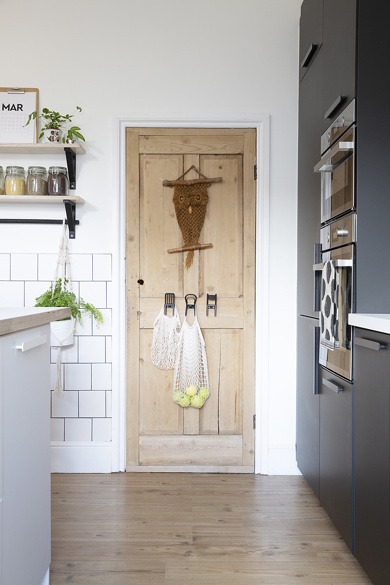 Moving the basement door away from the alcove made the layout fall into place and freed up space for the oven, microwave and fridge-freezer