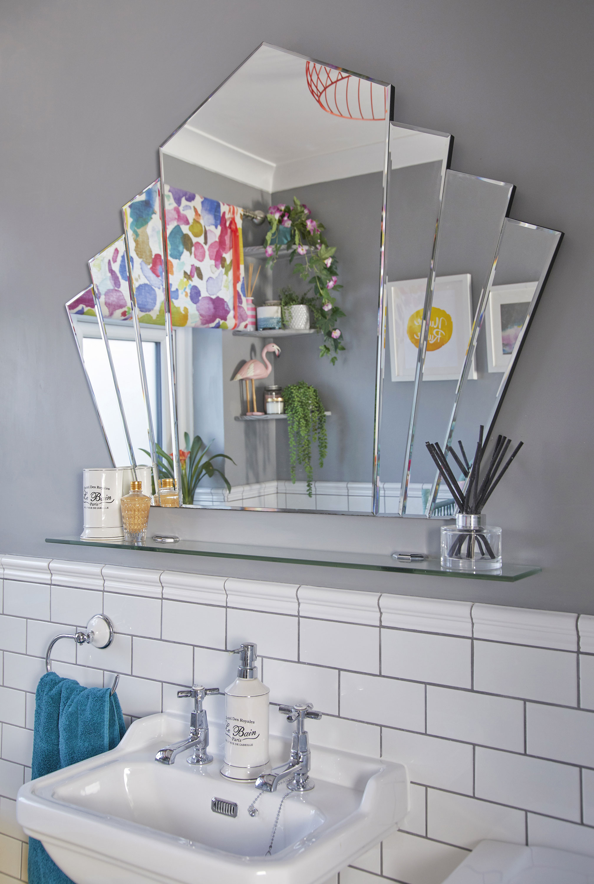 Bathroom makeover: 'My yellow bath makes me smile' ‘I already had this art deco-style wall mirror from Dunelm, and it’s finally found its pride of place in this room. The glass shelf fits perfectly underneath and is useful as an extra bit of storage’