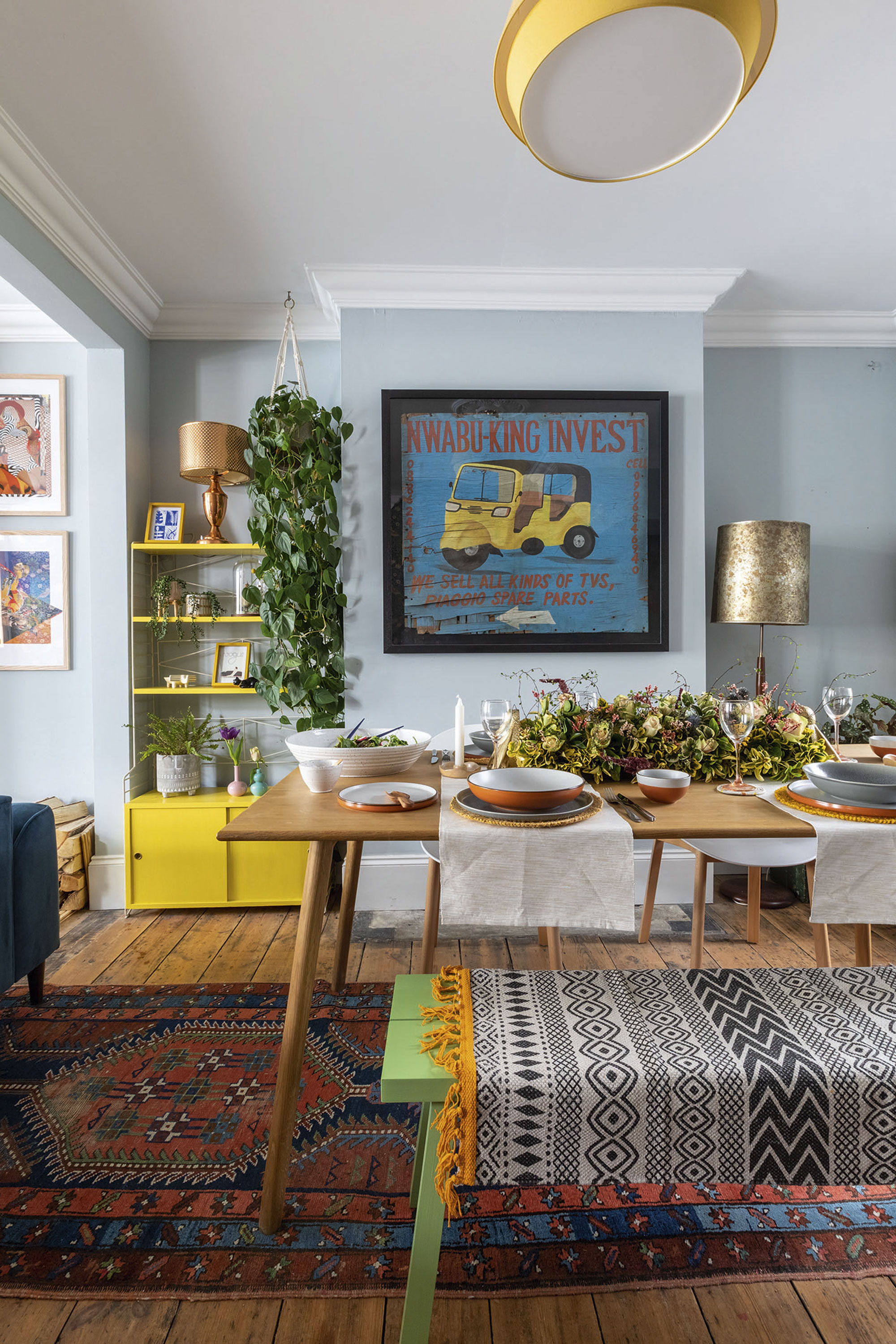 'Renovating gave us a blank canvas for our colourful, creative home' In the dining room, an African street sign Johan brought back from Malawi sets the tone for more colour, with a rainbow of crockery from Habitat. Bench-style seating makes for a cosy and sociable atmosphere