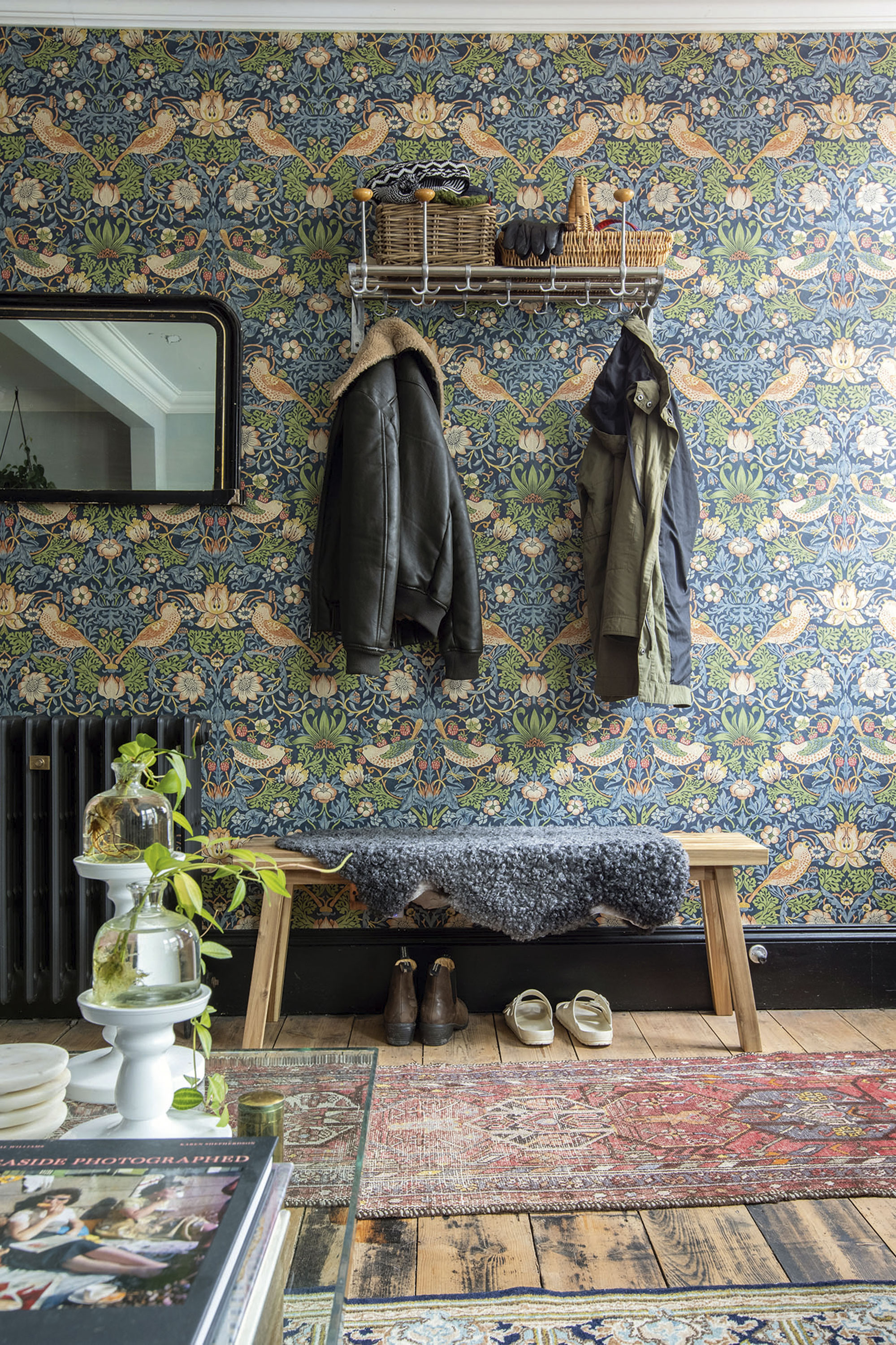 'Renovating gave us a blank canvas for our colourful, creative home' In the hallway, William Morris’s Strawberry Thief wallpaper sets the tone for a bold, design-led house. A vintage coat stand from Johan’s parents is complemented by an IKEA bench and Swedish sheepskin