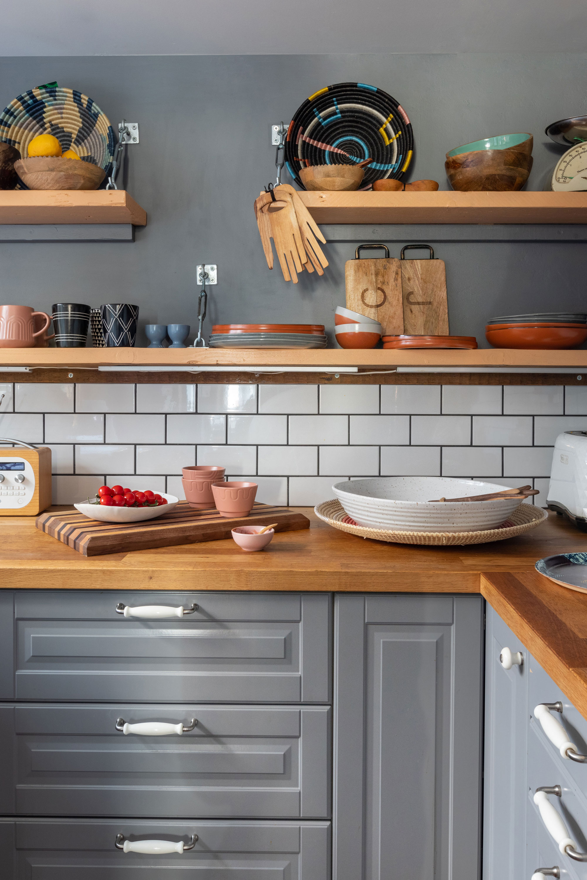 'Renovating gave us a blank canvas for our colourful, creative home' Rather than fitting wall units, Johan made the kitchen shelves from scaffolding boards, held up by turnbuckles screwed into the wall