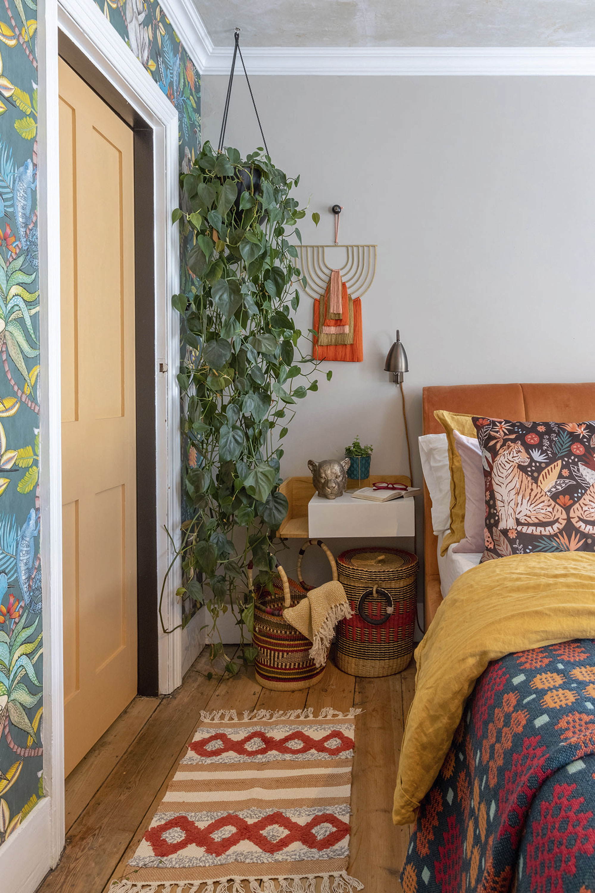 'Renovating gave us a blank canvas for our colourful, creative home' The trick to mixing patterns is using the same palette throughout for a cohesive look, as Carey has in the bedroom, with baskets from Artisans & Adventurers, an Oliver Bonas wall hanging, a rug from Three Little Pigs, and a Trefriw Woollen Mills blanket